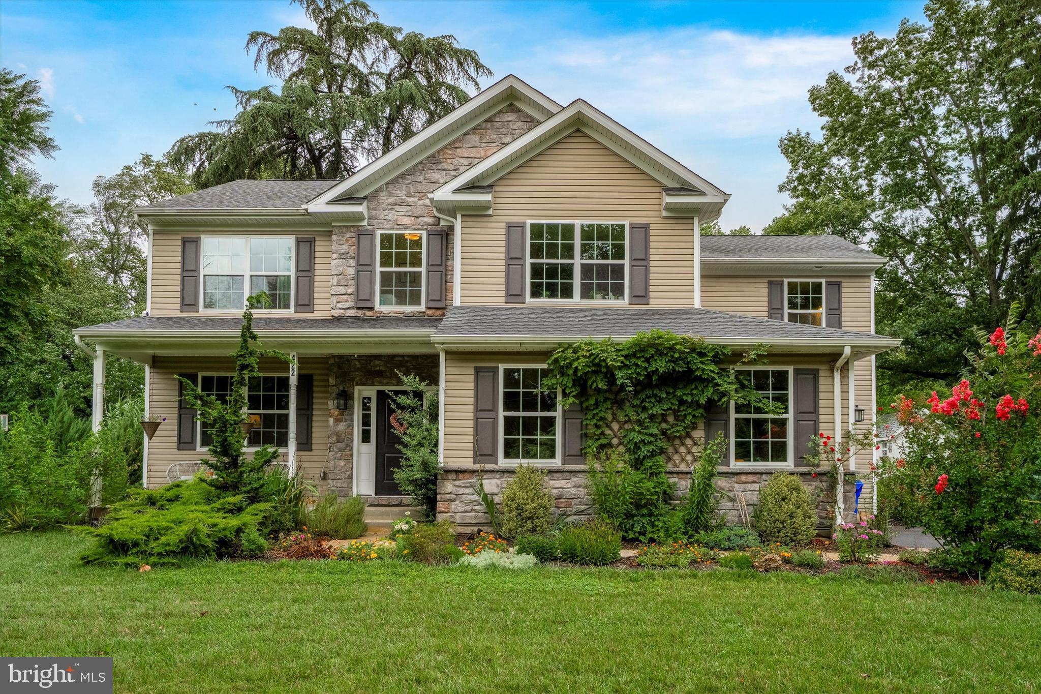 Welcome to 422 Rices Mill Rd, a luxurious contemporary design in the heart of historic Wyncote! Perched atop an elevated and private .47 acre lot, this 2018 build is packed with gorgeous features and finishes. Enter the foyer and delight in the spacious open concept design, featuring 9ft ceilings and wrought iron balusters adorning the center hall staircase. Just off of the foyer is a formal living room that flows perfectly into a dining area, with wainscoting and crown molding for a touch of formal flare. The contemporary yet timeless kitchen has plenty of granite counter space with a seatable island, 42” soft-close custom shaker cabinets and a large double pantry. Adjoining the kitchen is a breakfast area with sliding doors to a rear slate patio, a perfect spot for enjoying your morning coffee. Flowing directly from the kitchen is a large, step down familyroom with a tray ceiling and a 36" raised hearth gas fireplace. Plentiful windows provide abundant natural light throughout the first level, while classic dark hardwoods elegantly tie all of the spaces together. Ascending to the second level, the allure of the wide plank hardwood floor continues to captivate. Entering through double doors, the primary suite boasts a 10 ft tray ceiling, dual walk-in closets and a stunning ensuite bath with dual sinks and beautiful tile work. The additional hall bath is spacious and modern, and just a few steps from the hall bath is the conveniently located laundry room. Three additional large bedrooms with deep closets are also found on this level. Next, make your way to the fabulous finished lower level, complete with a full sized window, lots of recessed lighting, an additional storage wing and a gorgeous full bathroom. Whether it’s additional living space, a hobby area, home office, or all of the above, there is enough room for it in this great basement! In addition to all of this lovely living space, the outdoor spaces are full of serene charm, and beautiful greenery. The rear yard is flat with expansive wooded views, and features a slate patio, barn style storage shed and an adorable fire pit area with a cozy stone retaining wall. Around front is a covered porch, nestled within an oasis of colorful flowering shrubs and trees throughout the front lawn. Finally, there is so much to love about the location of this great home. Enjoy close proximity to numerous schools and universities. Get outdoors in several neighborhood parks including the renowned Curtis Arboretum. Grab a bite and see a concert in Keswick Village, or catch a train at the Jenkintown-Wyncote station for a quick commute to Center City. Additional features include a whole house back-up generator, and a whole house water filtration system. Don’t miss the chance to make this turnkey beauty yours, schedule a showing today! **This home is eligible for a grant from Prosperity Home Mortgage, for up to $10,000 toward borrower's down payment/closing costs! Please see attached flyer for details.**
