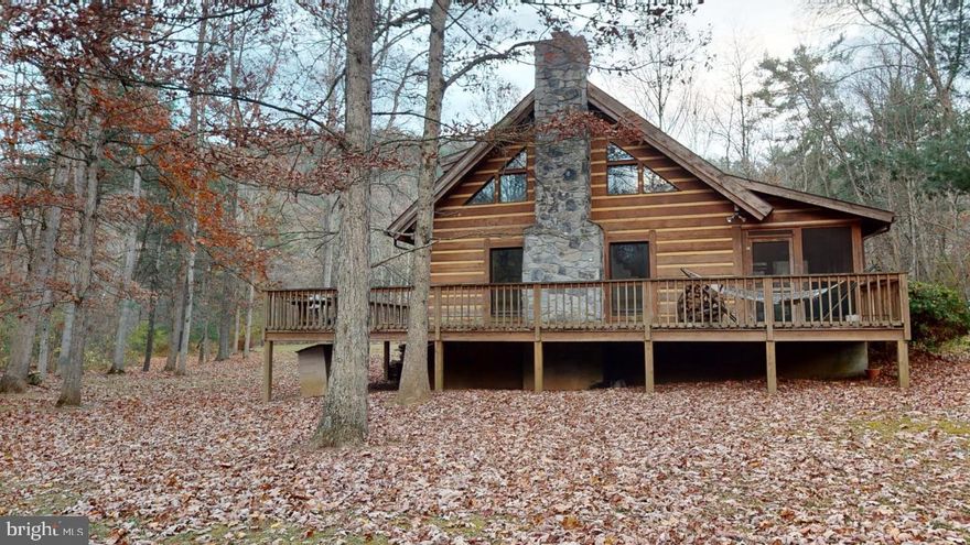 Here it is….. A peaceful and perfect property to enjoy country living.  Great location and plenty of room to expand or keep it as it is.  Mostly wooded with water near by.  Open floor plan and laundry on main floor.  Craftsmanship galore with large logs making this an authentic cabin.  Home needs a new kitchen and the area is ready for your expertise.