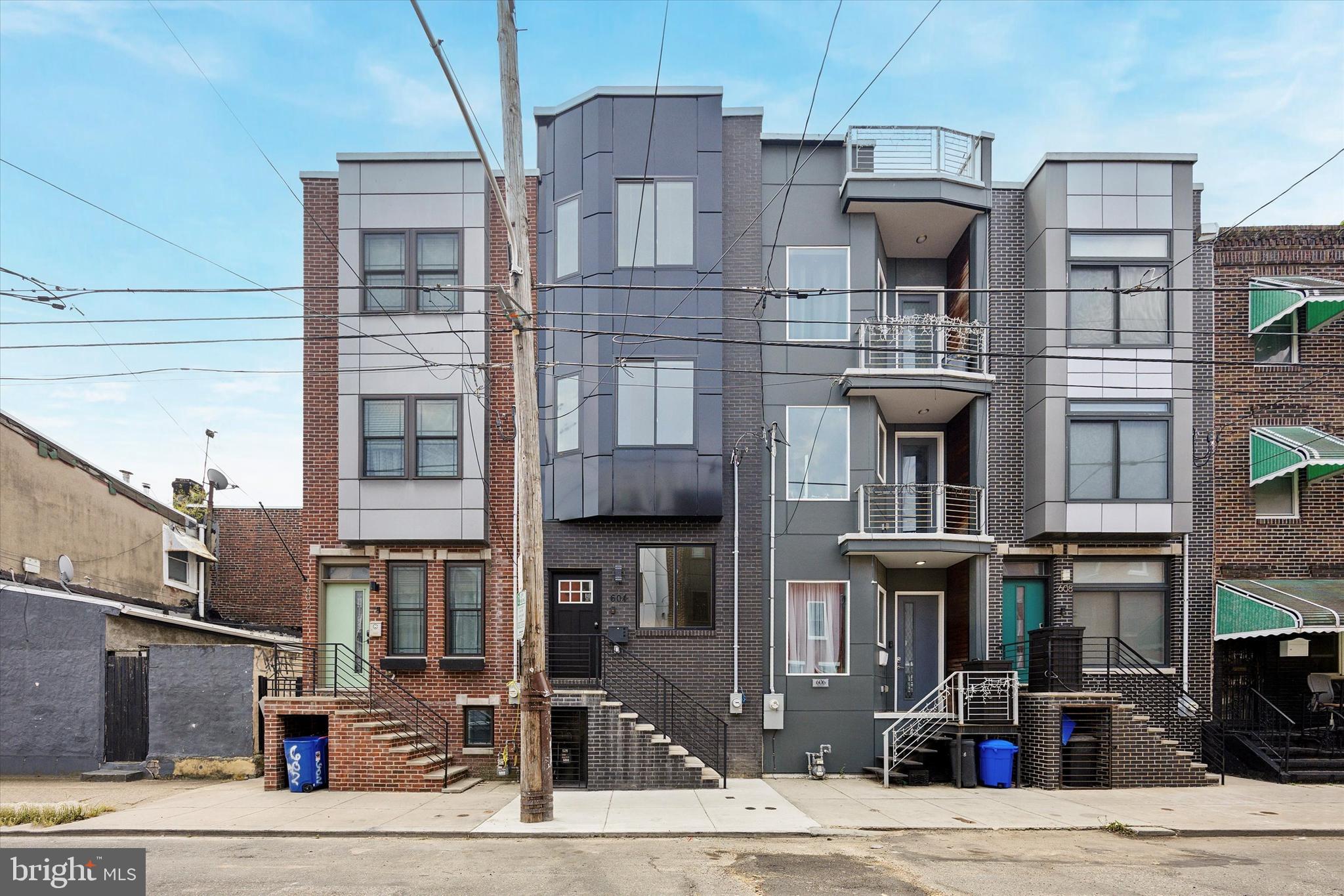 Welcome to 604 Mckean St, GOLDEN TICKET !! A stunning finished brand-new construction home with 10 years abatement located in South Philadelphia’s East Passyunk Crossing. This gorgeous single family was constructed meticulously builder. Spanning just under massive 2800 square feet, this expansive 4-bedroom home boasts above-average amenities with 3 full bathrooms plus finished basement distinctive lighting golden packages smart home Ring fixtures, along with built-in speakers and much more .Enter the living room with almost 10 ft high ceiling which give you a lot of natural light and take note of the generous width afforded by the 14-foot-wide property lot. Continue through the spacious dining area into the open concept gourmet state of art two color kitchen which is featuring quartz countertops along with full backsplash , a complete kitchen island, and white shaker cabinetry including pat filler. The state of art stainless steel appliances consists of a full dishwasher, oven range, double door refrigerator, step out back to appreciate the spacious rear patio and nicely appointed deck with a 6 ft privacy fence and ample space for outdoor living and entertaining. The 2nd floor includes 2 full bedrooms, a full-sized stackable laundry closet, and a shared hallway bathroom featuring a soaking tub shower, quartz vanity top, and undermount sink. Ascend to the third floor through impressive private owner’s suite, which consists of huge closets, speakers’ system and accent tray lighting on the ceiling. When you enter the owner’s ensuite primary bath you will be stunned with the features an oversized stall shower, perfectly appointed standing tub , twin vanity undermount sinks with upgraded golden widespread faucets. Don’t overlook the 360-degree views from the 300+ square foot roof deck. From this side of South Philadelphia, you can see the stadiums, the bridges, and the skyline. Before you leave, be sure to visit the fully finished basement, which includes an additional full bathroom and under-stair storage closet. Arrange your tour today and ensure you seize the opportunity to own a piece of this thriving neighborhood in South Philadelphia!