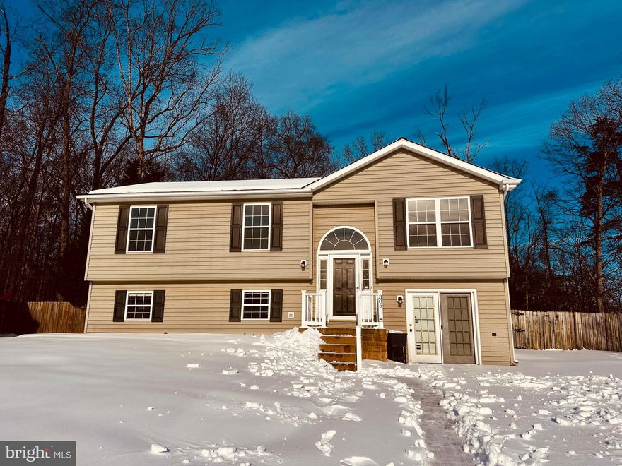 Don’t let the snow stop you from discovering this beautiful home! Tucked away on a quiet cul-de-sac in the Timberwood Village subdivision of Bunker Hill, WV, this welcoming residence is ready for a new family to fill it with love and lasting memories.

The main level offers a spacious and inviting living room that flows seamlessly into the dining area and kitchen—perfect for everyday living and entertaining. Two comfortable bedrooms and a full bathroom complete this level.

Downstairs, the lower level offers incredible flexibility and can easily accommodate two additional bedrooms, a private primary suite, or a family and recreation room—endless possibilities to fit your needs.

Step outside to a fully fenced backyard designed for enjoyment, featuring a deck, patio, and a 12x14 outbuilding with electric—ideal for storage, a workshop, or hobbies.

This home offers space, versatility, and a fantastic location—don’t miss your chance to make it yours!

Roof is 2 years old and has a current warranty. All appliances are 2-3 years old.  Seller is offering a one-year home warranty.