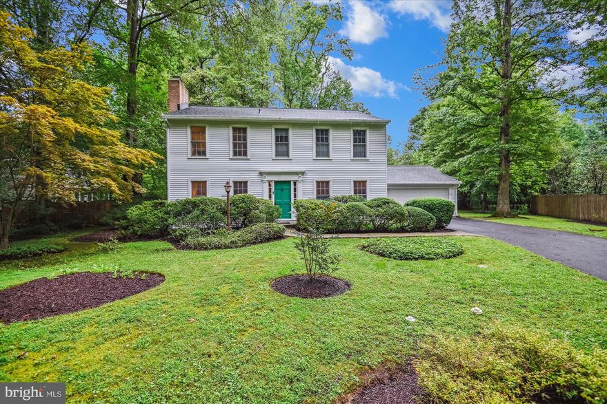 Price  reduced on this lovely Amberley home! Tucked away on a private, nearly 1-acre lot in Amberley, surrounded by mature trees and landscaping, this lovely well maintained colonial offers the perfect blend of comfort, charm, and functionality. With 4 spacious bedrooms and 2.5 baths, this home is ideal for both everyday living and entertaining. The bright, eat-in kitchen features stainless steel appliances and flows seamlessly into the cozy family room—complete with custom built-ins and direct access to a newly updated four-season sunroom with luxury vinyl plank flooring.  Hardwood floors span the entire first floor, adding warmth and elegance, with the exception of the laundry room, which features brand-new luxury vinyl flooring for durability and style. This home blends modern updates with timeless charm. The formal living room provides a welcoming space with a fireplace for gatherings or quiet relaxation. Just off the kitchen, the formal dining room offers flexible use—easily transforming into a home office or study to suit your lifestyle. Upstairs, the large primary bedroom boasts hardwood floors and a renovated en-suite bath. Three additional generously sized bedrooms, two carpeted, offer ample space and storage. The mostly unfinished basement is full of potential—perfect for creating a home gym, playroom, or extra storage space. Outside, a 14 KW  generator provides added convenience and peace of mind, ensuring your home is always ready for any situation. Residents of Amberley enjoy exclusive access to three community piers, boat slips, and a kayak launch, making it an exceptional location for water enthusiasts. Located in the award-winning Broadneck school district, close to downtown Annapolis and major commuting routes, this is a rare opportunity to own a  home in one of Annapolis’ most coveted communities!