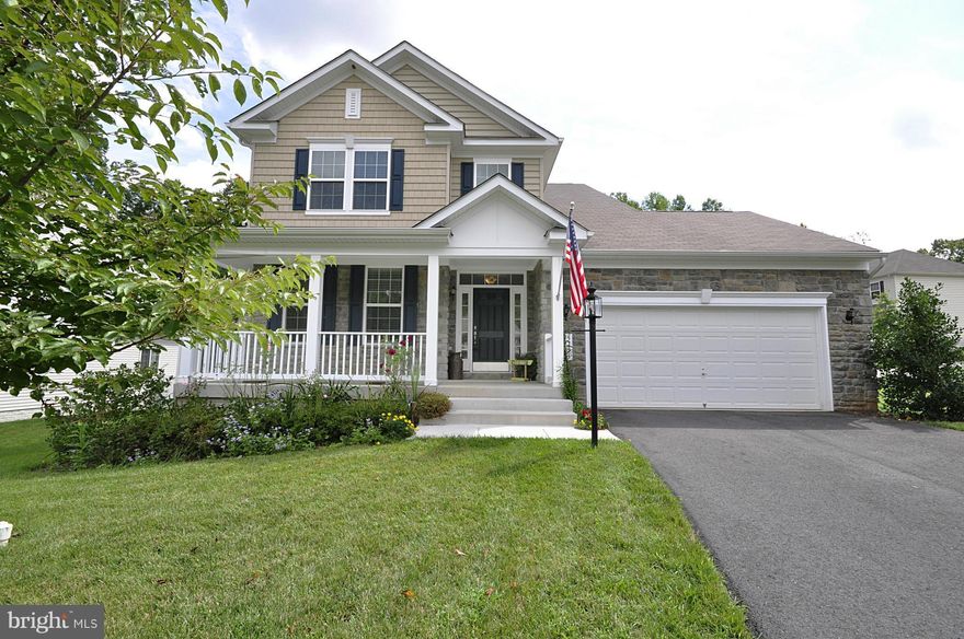 Enjoy this large stone front home in a great location.One of the larger lots in subdivisionThis home boasts 4 bedrooms 3 full baths with upper level laundry, wood floors on main level,spacious finished basement with two bedrooms NTC and large rec room.Gourmet kitchen with eating area and more to see. Wonderful deck overlooking beautiful white fenced back yard and trees. Easement gives side privacy