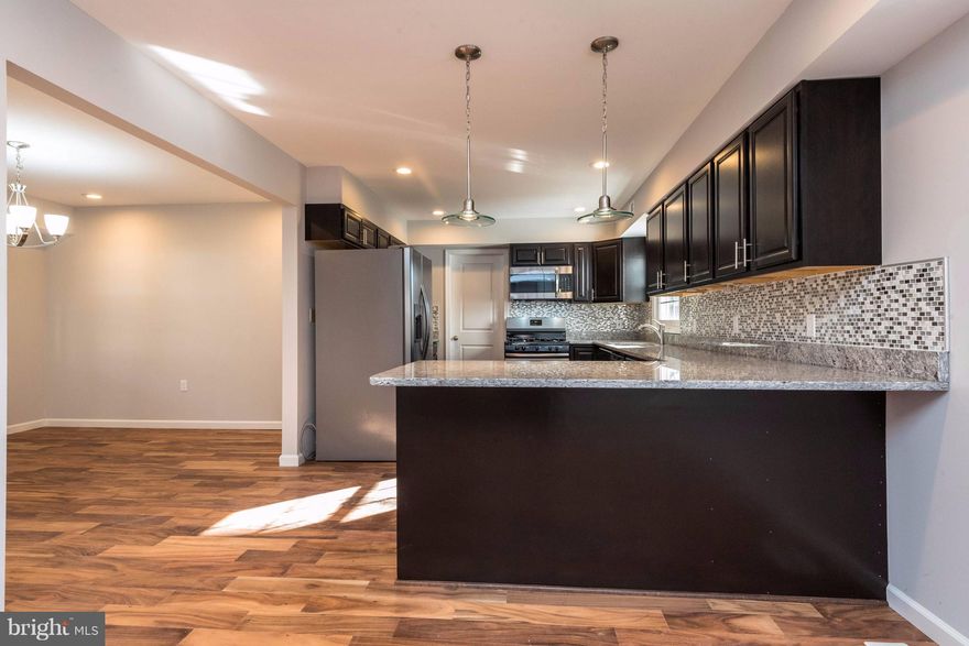 ***Back on the market.  Fall in love with this BEAUTIFULLY renovated home in highly desired Bowie   fully upgraded to fit your lifestyle! Featuring DAZZLING hardwood floors, a kitchen that boasts a GIGANTIC peninsula w/ GORGEOUS granite counter tops, top of the line Stainless Steel appliances, recessed lighting, an added Sun Room, an added Covered Porch in the rear.