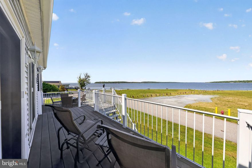 Enjoy unlimited waterfront views of the Elk River and the Chesapeake Bay from this beautifully maintained, original-owner cottage. This fully furnished 2-bedroom, 2-bath retreat is move-in ready and perfect as a primary residence, vacation home, or investment property. Inside, the home features a spacious primary suite with a full bath and closet, along with an open-concept living room, dining area, and kitchen. Vaulted ceilings, a breakfast bar, and two sets of Andersen French doors create a bright, airy space filled with natural light. Expansive windows frame stunning views of the community open space, bluff, beach, and water beyond. Step outside to a large front deck—ideal for entertaining or simply relaxing while taking in the scenery. The elevated design of the home allows for a versatile lower level with a patio, driveway, and storage, offering endless possibilities. An additional deeded lot is included and houses the septic system, adding extra value and flexibility