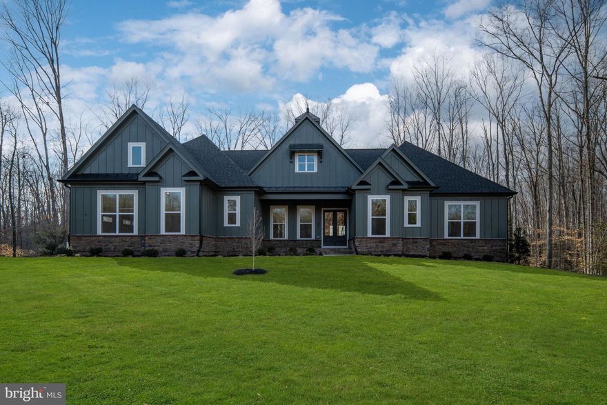 Introducing an exquisite waterfront opportunity to build your dream home in the picturesque Rosni Estates waterfront community of Fredericksburg. Nestled in a serene waterfront setting, this to-be-built masterpiece offers a truly bespoke living experience.

This example is the luxurious NOEL home design that includes 4 spacious bedrooms, and 5 elegant bathrooms spread across 3,287 square feet of meticulously crafted living space. The open-concept floor plan is enhanced with hard surface flooring throughout the main level, creating a warm and inviting atmosphere. The chef’s kitchen is a culinary delight, featuring quartz countertops, custom cabinetry, and top-of-the-line stainless steel appliances, all illuminated by modern recessed lighting.

Each home comes with a minimum 3-car side entry attached garage, offering ample storage and convenience. Additionally, there is plenty of space to add personalized structures, should you desire. The exterior is accentuated with stylish stone water tables, adding a touch of elegance to the overall design.

With a limited selection of exclusive homesites, you have the freedom to choose from a curated portfolio of plans or bring your own vision to life. This is the essence of the Custom-Building Experience—if you can dream of it, we can help make it a reality.

Don’t miss this rare chance to create a haven that perfectly fits your lifestyle in a coveted location. Discover the endless possibilities of luxury living in Fredericksburg today. Photos are representative of the Bryton Custom Homes craftsmanship and finishes, they are not of the NOEL home design. Inquire about the other available lots and models in this community.