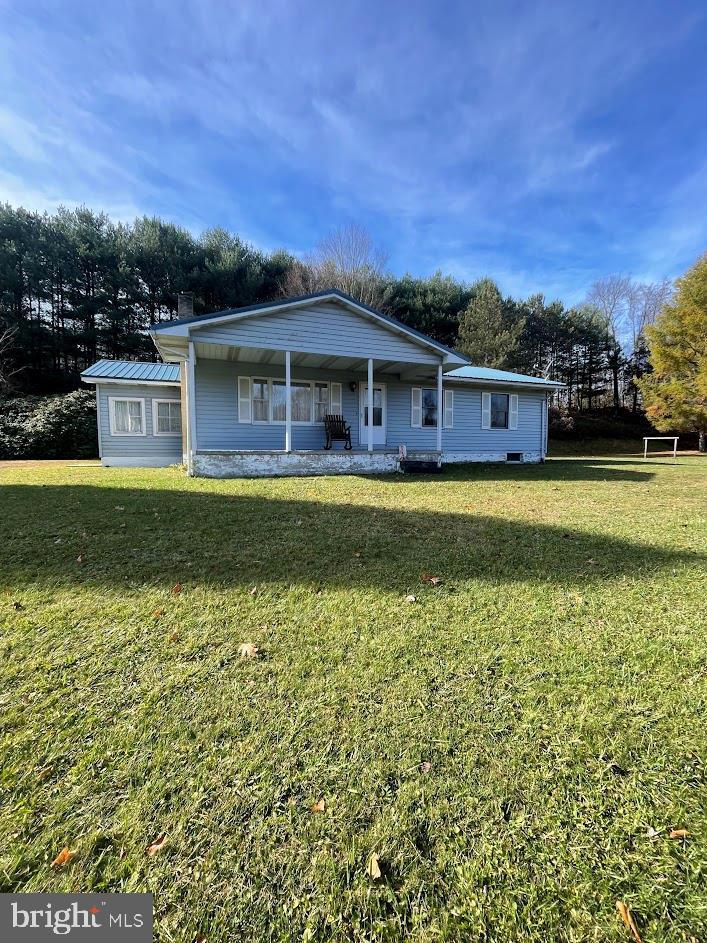 An immaculately kept ranch home that is tucked away along Tyrone Pike. This home is sitting on 12.9 acres and features three bedrooms, one bathroom, metal roof installed in 2017, a clean basement, and a two stall garage with two stories surrounded by trees and wildlife.