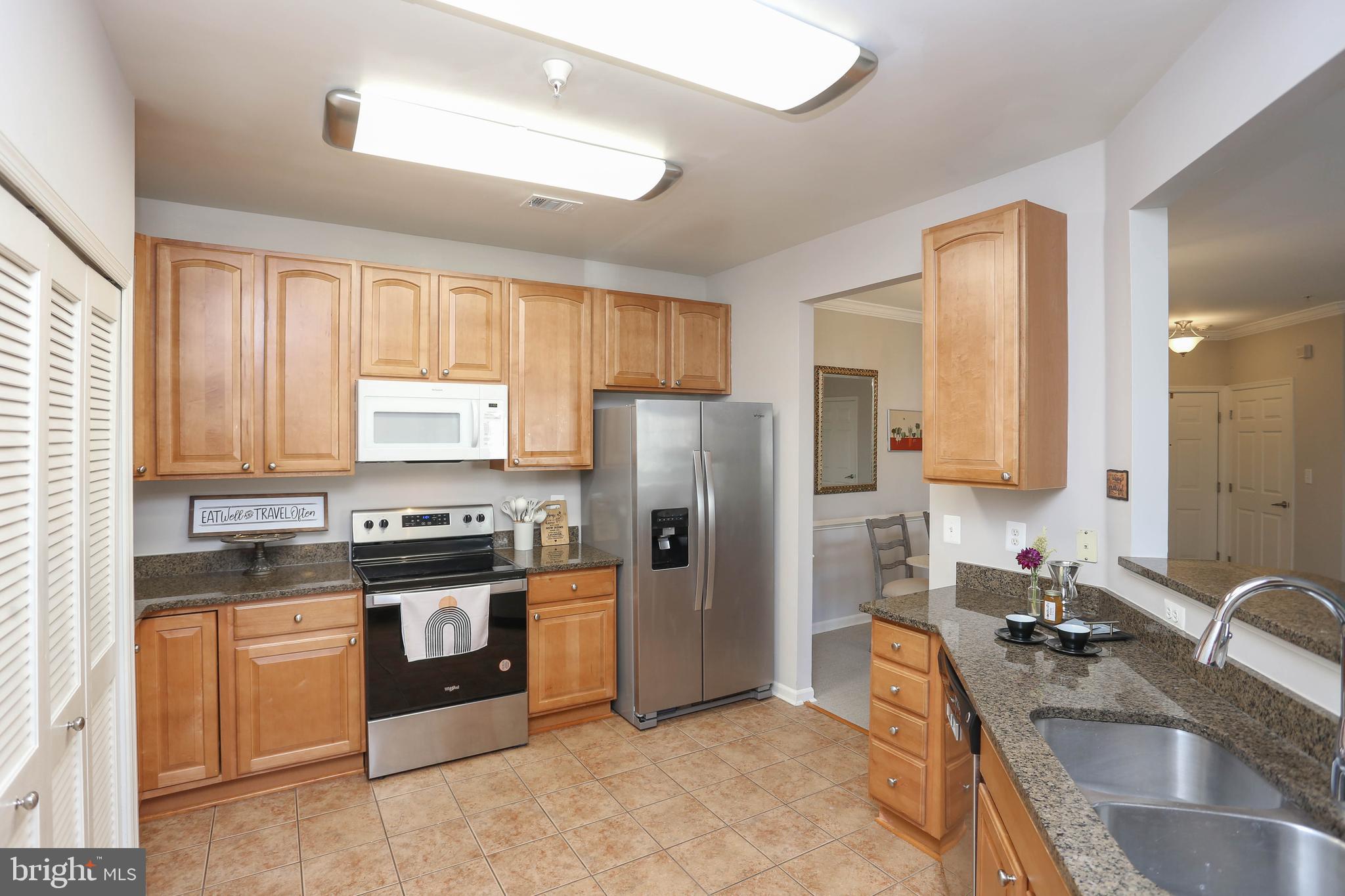 OPEN HOUSE SATURDAY 9/13 11-1PM & SUNDAY 9/14 12:30-3:00PM-DON'T DELAY!. Move right in to this beautiful two bedroom two bath condominium in Elkridge Crossing. This unit combines low maintenance, with comfort and style! Conveniently located on the third floor with easy elevator access. You will enjoy entertaining with the kitchen that opens to the living room and dining room. The kitchen features 42" cabinets and granite counters. The primary bedroom features a large private bath with new shower (2024) and walk-in closet. Two Hydroviv water filters!!The HOA fee includes water and the water heater was new in 2023!