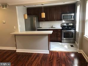 Step into this fully renovated two-level apartment featuring beautiful modern finishes throughout. This spacious home offers 3 bedrooms and 2 full bathrooms, with 2 of the bedrooms located on main level for convenience. There is an in-unit washer and dryer, and direct access to a private backyard. Enjoy the ease of an off-street, 2-car parking pad.  Move-in ready and waiting for you!
