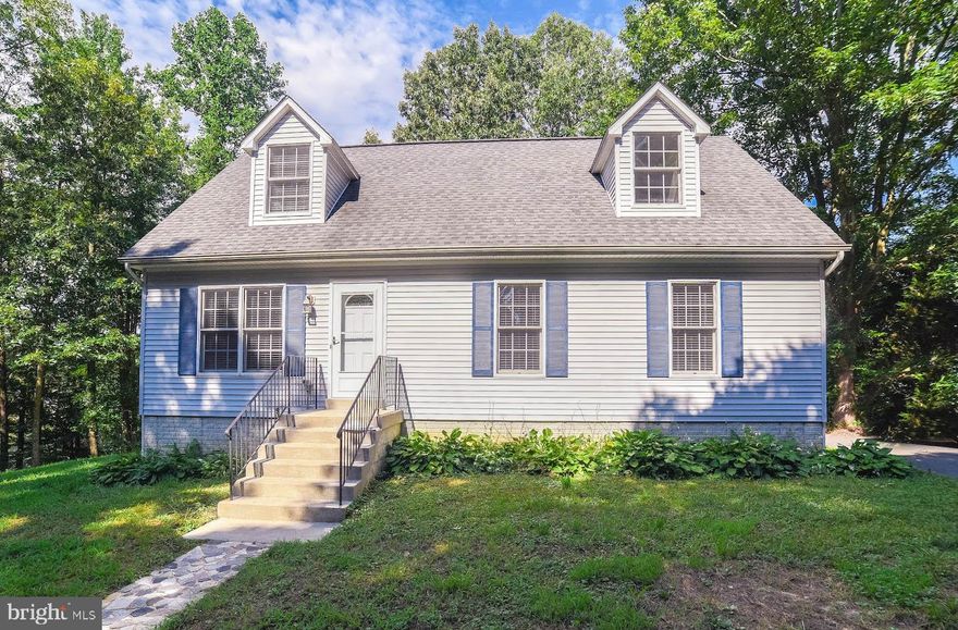 WOW!  3 Bedrooms and 2 Bedroom/Office/Den in Basement, 3 Full Baths, 2nd Kitchen in Basement, 2 Bedrooms/Office, perfect for In-Law type scenario - New Carpet, Fresh Paint, BIG Deck that overlooks a Nice Large Private Lot, Circular Driveway, New well installed June 2019, Updated, Cleaned and waiting for you.  Don't Miss Out.