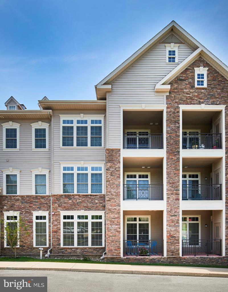 Move-in ready condo offers wonderful amenities both inside and out, providing an open floor plan, 9 foot ceilings, bright windows and covered balcony. The kitchen provides granite countertops adequate storage with plenty of cabinets, pantry closet and a useful built-in desk/office area. In the spacious master bedroom suite, appreciate double sinks, a tile shower and a walk-in closet. A sitting room off the bedroom makes for a true master suite, second bedroom has private access to the second bath. There is a separate laundry room in the unit. Just steps away, the clubhouse features an indoor pool, fitness center, sauna, steam room, and a large great room complete with a pool table, fireplace, televisions and fully stocked kitchen so you are prepared when entertaining a larger crowd. The condo includes one assigned parking space in the garage with additional parking in the outside lot great proximity to shopping, campus and town make this property a wonderful choice and a great value.