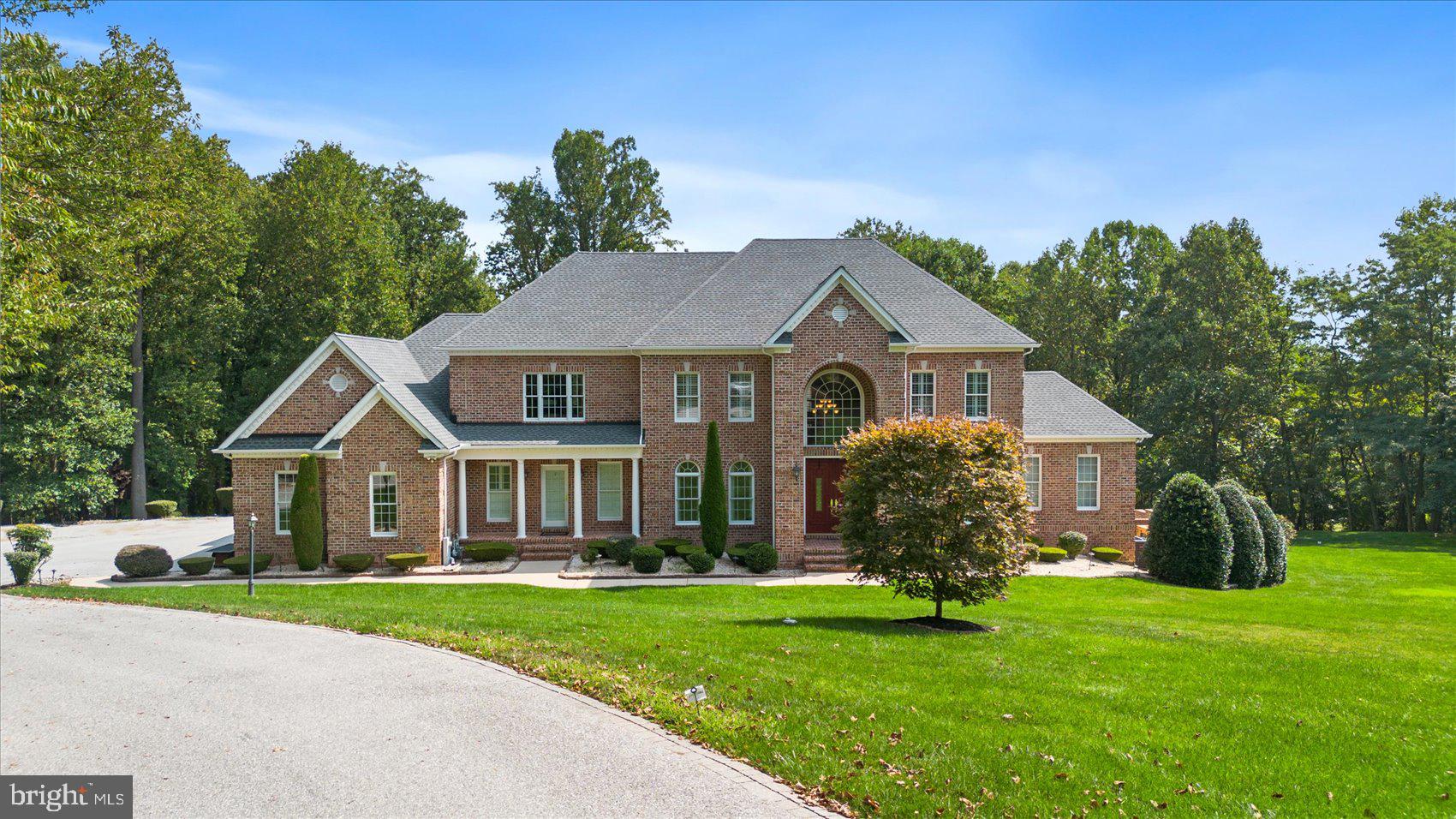 Welcome to 15 Batterbrook Court, a magnificent estate nestled in the serene landscape of Kingsville, MD. Set on 4.63 acres of meticulously maintained grounds, this property offers a private oasis complete with a heated in-ground pool and a custom hardscaped sitting area featuring a built-in fire pit—ideal for relaxing or entertaining.
As you step into this luxurious all-brick colonial with over 8300 sqft of finished living space, you'll be immediately impressed by the grand 2-story foyer with gleaming marble floors. The main level unfolds into an expansive 2-story family room, enhanced with hardwood floors and a cozy wood-burning fireplace, creating a warm and inviting atmosphere surrounded by crown and box moldings that exude elegance and sophistication throughout. The heart of the home is the oversized kitchen, designed for both style and functionality. It boasts a large center island with granite countertops, brand new high-end appliances, and a butler's pantry. Adjacent to the kitchen is a bright breakfast room offering stunning views of the pool area. Step outside onto the spacious deck from the sunroom or den to enjoy the tranquility of the estate-like setting.
The upper level is equally impressive, featuring four generously sized bedrooms with brand-new carpeting and three full bathrooms. The primary suite is a sanctuary of luxury, complete with a tray ceiling, a sitting room, wet bar and a gorgeous bathroom. Every room on this level has been freshly painted, ensuring a move-in-ready experience.
The lower level is an entertainer’s dream. It includes a fifth bedroom suite with a walkout to the patio and pool area, offering guests a private retreat. The large recreation room is perfect for gatherings, featuring a full bar, a freezer, a large refrigerator, and a wine room for the connoisseur. A second wood-burning fireplace adds to the ambiance, creating an ideal space for both relaxation and entertainment. A second full bath with a steam shower also exists on the lower level.
Additional highlights of this exceptional property include a massive 4-car garage with brand new doors, an electric gate for added security and privacy, and a multiple-car driveway to accommodate guests. Recent updates enhance the home's value and efficiency, including a new roof, gutters, and downspouts installed in 2023, new HVAC systems added in 2022/2023, and 2 new water heaters from 2020. The 40kw generator ensures uninterrupted comfort regardless of the weather.
15 Batterbrook Court is more than just a home; it’s a luxurious retreat that offers an unparalleled lifestyle in a stunning, secluded setting. Don't miss this rare opportunity to own a piece of Kingsville’s finest real estate!