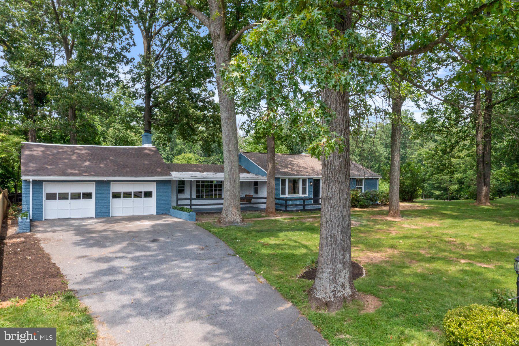 Newly renovated 3BR/3BA expanded, sprawling Rancher located on a forest-like lot in the countryside of Carroll County. Park in front of the attached expansive two-car garage, and make your way to the front porch of your new home. This home has been fully renovated from top to bottom offering you a brand new home to call your own. Step inside to a home filled with natural light, a soft color palette, luxury flooring, and the open floor plan homeowners are seeking. The main living space consists of a large dining room, a gorgeous kitchen, and a family room. The kitchen features plenty of cabinets, mixed metal accents of gold hardware and stainless steel appliances, sleek granite countertops with a complimenting tiled backsplash, an island with a slide in electric range, pendant lights and breakfast seating, and a deep sink under a window. Just steps from the kitchen is the cozy family room featuring a wood burning stove insert with a stone hearth and mantel, a stone feature wall, and access to the two-car garage. Down the hall is a sizable secondary bedroom, a full bath, and a primary bedroom with a walk-in closet and private full bath featuring a beautifully tiled walk-in shower. The lower level is finished offering the third bedroom, a full bath with walk-in shower, a large family room, storage, and laundry. From the main floor step outside to a large deck that overlooks a yard filled with green space, adult shade trees, and so many possibilities. This home is perfect for any new homeowner and is located in close proximity to shopping restaurants, and commuter routes.