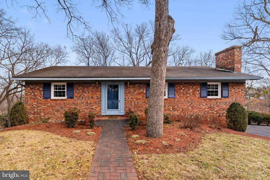 SHORT SALE: All brick ranch home with 4 bedrooms close to town and a short walk to the golf course! Main level large living Room and dinning room, 2 bedrooms and 2 bathrooms, an eat in kitchen, has gleaming hardwood flooring. Lower Level large area for pool table 2 more bedrooms, 1 bathroom and a family room equipped with a brick fireplace and space for a pool table. There is a sliding glass door that leads to a spacious deck with steps to the yard. The basement includes a shop area that could be used as storage or for hobbyists, laundry area and a third bath. There are 2 off street parking spaces. NOTE: The driveway is a shared driveway, 2/3 of the paved area belongs to this property, 1/3 belongs to the property to the right. There is space for 2 cars in the driveway.