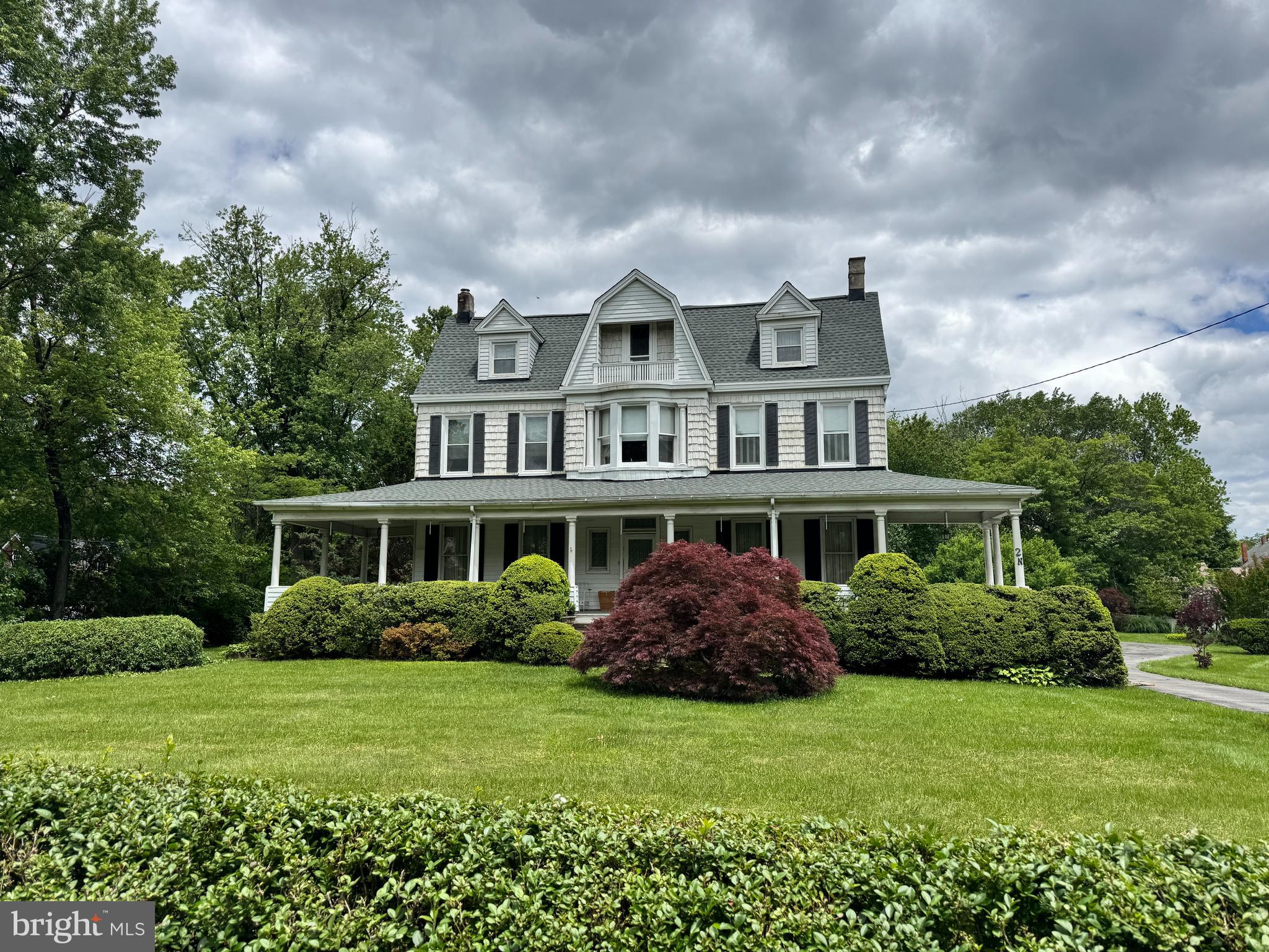 Welcome to this timeless Catonsville gem—where character, charm, and convenience meet! Ideally located within walking distance to top-rated schools, beloved local shops, and popular restaurants, this classic home offers the perfect blend of historic appeal and modern potential.
Step onto the expansive wrap-around porch, perfect for morning coffee or relaxing summer evenings. The large front yard adds to the home's impressive curb appeal, while the scenic backyard offers a private oasis for entertaining, gardening, or simply enjoying the outdoors. A spacious circular driveway ensures plenty of parking for family and guests.
Inside, you'll find hardwood floors throughout, multiple fireplaces and a wood-burning stove, and large windows that flood the home with natural light. With ample living space across the main level, there's room for every lifestyle—from cozy evenings in to lively gatherings.
Upstairs, discover five generously sized bedrooms and two full bathrooms, providing comfort and flexibility for a growing family or guests. The walk-up attic features high ceilings and abundant space, offering the potential for a third finished level—perfect for a home office, playroom, studio, or additional bedrooms.
Additional highlights include a brand-new roof, timeless architectural details, and the warmth and character only a classic Catonsville home can offer.
Don't miss your opportunity to own this incredible property in one of the area's most sought-after neighborhoods!