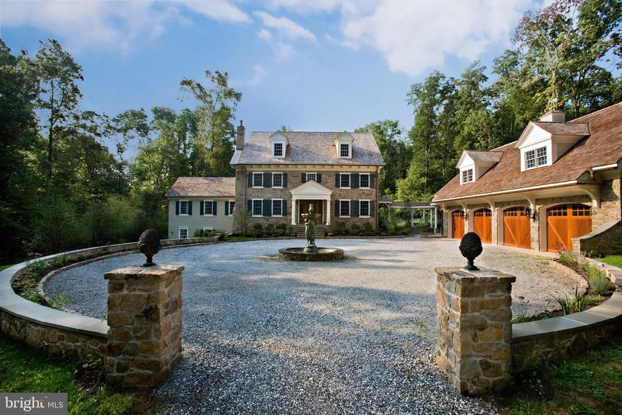 This is a True Dream Home built in 2007.  Imagine coming home to this gated estate, driving up your meandering drive way that crosses a stone bridge over babbling brooke to this Stunning home!  This estate is a historically accurate recreation of a late 18th Century Pennsylvania farmhouse and it also incorporates the latest and best "green" building techniques and materials available today.  The Manor House is carefully sited in the middle of 21 acres.  The 1st floor offers:  2 story foyer, library with built in cabinets, book shelves and fireplace.  Formal dining room is appointed with Brazilian Cherry flooring, repurposed antique brass lighting and a fireplace repurposed from an exclusive private 19th Century Philadelphia club.   The kitchen which is one of a kind,  has travertine heated flooring, viking range, subzero fridge, Amish made custom cabinetry with wood, harvested from the homesite.  This beautiful kitchen overlooks the conservatory with retractable roof.   The family room and Kitchen both have Rumford wood burning fireplace designed by an 18th century Count who thought to perfect and improve the inefficient fireplaces in PA homes at the time.  The masonry fireplace radiates tremendous heat, draw well and is an important feature in this home.  The 2 story vaulted family room has structural beams also harvested from the homesite, wood burning fireplace, tiled heated floor, custom lighting, and 3 sets of french doors leading to your arbored veranda and wisteria.  The 2nd floor has a wonderful master suite,  lighted tray ceiling, window seats, gas fireplace, large bathroom, whirlpool tub, walkin tiled shower, water closet with bidet, 2 separate dressing rooms and built in custom closets.   2 additional bedrooms and bathroom on the 2nd floor.  Attic or 3rd floor is ready to be finished with plumbing for additional bathroom.  The basement has another bedroom, bathroom, lots of storage and dance studio or family room. Covered walkway to the 4 car garage has PA flagstone pavers and caps with low walls to enjoy your stunning grounds.  The 4 car garage has wood doors, 1,000SF apartment above offering a kitchen, full bath, bedroom and living room with gas fireplace.  Additional features such as 21 acres, salvaged components and antique features were carefully utilized such as lighting and front door from Italy.   Hidden behind the stone and cedar are insulated panels with R values over 26 to 40.  Remaining insulation is closed-cell urethane foam and ultra tight envelope is ventilated by 2 energy recovery ventilator systems.  The eastern wing which appears to be a later addition and finished stucco is built of insulated concrete forms as basement walls the R value is nearly 40.  Anderson windows, Solar heated PEX radiant tubing and high efficiency propane boiler supplements when the sun is sparse.  This  timeless dream estate promises to provide you and your family many memories and the serenity you are looking for in a home like this. Make this your home today!