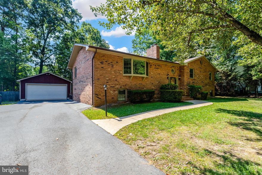 Welcome to this stunning 5-bedroom, 3-bath brick home situated on a private, fenced, and level lot in the highly sought-after front section of Aquia Harbour! This gated community offers a wealth of amenities, including a community pool, horse stables, golf course, tot lots, tennis courts, and more. Conveniently located just a 3-minute drive to I-95 and 15 minutes to Quantico.
This inviting 3,400 sq. ft. residence features ample storage, hardwood floors, custom neutral paint, and new carpeting. The bright, light-filled kitchen boasts granite countertops, dual ovens, a breakfast bar, and a walkout to a spacious deck perfect for entertaining or grilling. Additional amenities include a fenced yard, a large detached 2-car garage, and abundant parking on the flat, paved driveway. Don't miss this incredible opportunity! Move in ready. Call today to schedule a tour.