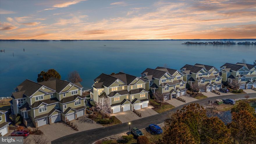 Pass through the iron security gate, travel along the elegant drive, and pull up to stunning waterfront "end unit" townhome living on the Chester River!  Welcome to 518 Narrows Pointe Drive, a waterfront townhome in the beautiful 38 unit community in proximity to the Bay Bridge and in the prime location for taking in holiday fireworks, magical daily sunrises, and all sorts of eastern shore wild life--Eagles, foxes, deer, herons and more! The townhome, with a newly painted interior (all ceilings, walls, trim) is flooded with natural light and offers multiple outdoor decks/porches (many with electric privacy window screens), including off the living room, kitchen and primary bedroom.  And there are water views on both sides--Chester River on one and the Safe Harbor Marina on the other, which separately offers membership for a pool, fitness center, boat slips, restaurants and more! NOTE: Seller providing a $1000 credit at closing which buyer may apply to a one year membership for the pool/gym. Additionally, Narrows Pointe boasts two of its own community piers--one fishing and one kayak launch, and a boat dock/slip (one pier w/ 3 slips), all taken care of by the HOA. As beautiful inside as out, the townhome's interior floors are primarily hardwood, with exception of carpeted bedrooms and tiled bathrooms. The counter tops of the kitchen and baths are granite with updated brushed-nickel hardware and the appliances (including a wine fridge) are stainless. There is a  sizable pantry and stackable washer dryer. The airy kitchen offers a gas stove top, ample island seating as well as a separate open concept dining area with spectacular views of the water.  Whether you prefer a shower with multiple shower heads, a jetted tub or a tub/shower combination, you have all at your disposal! And don't forget about the floor to ceiling stone gas fireplace, perfect for sitting by on chilly winter nights.   You also have a two car attached garage, just resurfaced in March 2026, off street driveway parking & the roof was  just replaced in 2024!  The lowest level off the garage provides you space to make a second family room, recreation room, play room or more (the owners utilize it currently as a home gym).
Do not assume townhome living means no where to store things! The sellers have gone to great lengths to add many custom storage areas including California Closets in the primary bedroom, garage closets and hanging storage, and all bedrooms offer large closet space, many walk-ins. Plus there is a large dry crawl space accessible upon entering the property bottom floor via the garage.
This property is only 20 minutes to Annapolis in one direction, 20 to Easton in the other, 45 min to BWI Airport, 55 min to Washington DC, 1 1/2 hours to the beach at Ocean City MD!
This is perfect for either a year round home or a weekend getaway.
Please see private agent remarks for a list of seller upgrades/ages of/costs of utilities, documents for association covenants and restrictions, etc.
Sellers may require a lease back to secure their next home.