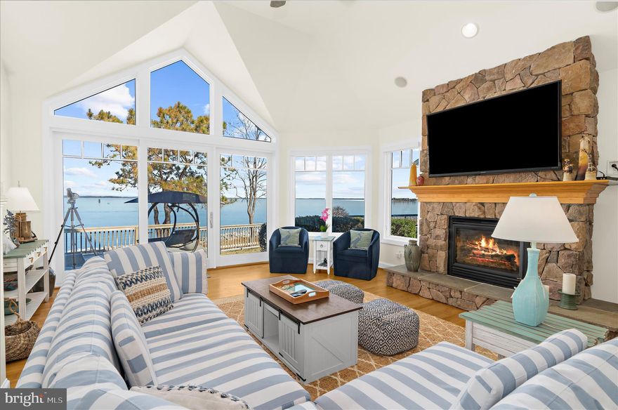 Pass through the iron security gate, travel along the elegant drive, and pull up to stunning waterfront "end unit" townhome living on the Chester River!  Welcome to 518 Narrows Pointe Drive, a waterfront townhome in the beautiful 38 unit community in proximity to the Bay Bridge and in the prime location for taking in holiday fireworks, magical daily sunrises, and all sorts of eastern shore wild life--Eagles, foxes, deer, herons and more! The townhome, with a newly painted interior (all ceilings, walls, trim) is flooded with natural light and offers multiple outdoor decks/porches (many with electric privacy window screens), including off the living room, kitchen and primary bedroom.  And there are water views on both sides--Chester River on one and the Safe Harbor Marina on the other, which separately offers membership for a pool, fitness center, boat slips, restaurants and more! NOTE: Seller providing a $1000 credit at closing which buyer may apply to a one year membership for the pool/gym. Additionally, Narrows Pointe boasts two of its own community piers--one fishing and one kayak launch, and a boat dock/slip (one pier w/ 3 slips), all taken care of by the HOA. As beautiful inside as out, the townhome's interior floors are primarily hardwood, with exception of carpeted bedrooms and tiled bathrooms. The counter tops of the kitchen and baths are granite with updated brushed-nickel hardware and the appliances (including a wine fridge) are stainless. There is a  sizable pantry and stackable washer dryer. The airy kitchen offers a gas stove top, ample island seating as well as a separate open concept dining area with spectacular views of the water.  Whether you prefer a shower with multiple shower heads, a jetted tub or a tub/shower combination, you have all at your disposal! And don't forget about the floor to ceiling stone gas fireplace, perfect for sitting by on chilly winter nights.   You also have a two car attached garage, just resurfaced in March 2026, off street driveway parking & the roof was  just replaced in 2024!  The lowest level off the garage provides you space to make a second family room, recreation room, play room or more (the owners utilize it currently as a home gym).
Do not assume townhome living means no where to store things! The sellers have gone to great lengths to add many custom storage areas including California Closets in the primary bedroom, garage closets and hanging storage, and all bedrooms offer large closet space, many walk-ins. Plus there is a large dry crawl space accessible upon entering the property bottom floor via the garage.
This property is only 20 minutes to Annapolis in one direction, 20 to Easton in the other, 45 min to BWI Airport, 55 min to Washington DC, 1 1/2 hours to the beach at Ocean City MD!
This is perfect for either a year round home or a weekend getaway.
Please see private agent remarks for a list of seller upgrades/ages of/costs of utilities, documents for association covenants and restrictions, etc.
Sellers may require a lease back to secure their next home.