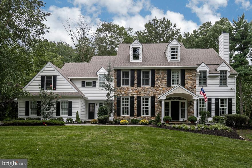 Stately stone home with incredibly low taxes in a most desirable private setting. You will immediately be wowed by the dramatic approach to this home, with its impeccably maintained grounds and property. The entire exterior has been upgraded with new insulated siding, and features a stately flagstone walkway leading to the double wide side transoms and welcoming front entrance.  The value is apparent immediately as you notice the quality in all new insulated siding with a new Trex deck out back. You will also notice the fact that this beautiful property has no stucco on the exterior.  Upon entering this home, you will be even more impressed by the completely updated interior, modernized floor plan featuring open floor plan, oversized doorways, and current architectural details.  The interior of this home boasts a traditional, center hall colonial floor plan, with brand new hardwood floors throughout the entire first floor, and a grand foyer and staircase.  As your eye is drawn to the right, you will find the stunning formal living room with fireplace, then to your left you will find the formal dining room with upgraded millwork.  French doors from the living room lead to the stately office with amazing views of the property, and sliding glass doors which allow you to enjoy a private side porch. The family room provides a grand setting, thanks to its cathedral ceilings, cozy fireplace and beautiful millwork.  It s floor to ceiling windows overlook a breathtaking view of the back yard, manicured landscaping, and mature trees.The open floor plan continues into the Chef s kitchen with Wolf and sub-zero appliances, double ovens,  and large island counter with seating and bar area. Custom cabinetry, neutral travertine counter tops, additional refrigerator, and high end built-ins also make this area very special. The breakfast area offers plenty of room for a generous table and chairs, and is  situated next to glass doors which lead out to the new Trex deck. Off of the kitchen is the mudroom, and laundry room, connected to the attached 3 car garage. For someone looking for a perfectly planned living space, this house checks all of the boxes!  Upstairs, the master bedroom features vaulted ceilings, extra large master closets, and dressing area. Details in the spacious master bath include marble floors, double sinks, storage, Jacuzzi tub and marble shower. Second,third, and fourth bedrooms have  large closets, and the hall bath is large enough for family and guests. The fifth bedroom is perfect for in-laws or au-pair: nestled on the opposite side of home from the master, this room can accommodate bed, office and leisure furniture with en suite full bathroom. One of this home s most impressive features is the fully finished, walk out full daylight lower level. The lower level offers a huge array of amenities  to begin with, there is a full family/TV area with surround sound, complete bar with seating, work out/gym room and full bathroom. Next, there are 2 large storage areas with built in cabinetry for ample storage. Finally, the lower level walks out onto the flat level yard, surrounded by mature trees which provide this back yard with complete privacy and a sense of serenity that is very difficult to find in such a convenient location. This location is 4 miles from the center of Bryn Mawr. 3.8 miles to the center of Wayne, 1.7 miles to the new Whole Foods market and shopping center, and 26 minutes to the Philadelphia airport! Who says you can't have it all!?
