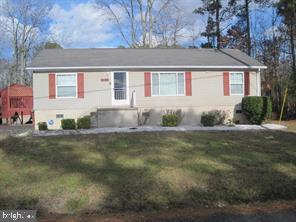 This beautiful 3 bedroom, 2 full bath Rambler was recently renovated and features new carpeting, flooring and freshly painted. Home comes with a laundry room and offers comfort, convenience and is situated on a level lot. Provides a peaceful escape with ample outdoor space. The kitchen boasts generous cabinet space and is open to the dining area, which leads to a side deck for a perfect spot to unwind and enjoy the waterfront view . The dining area also offers convenient access to the side driveway, making daily tasks simpler. A brand new outdoor storage shed was recently installed for maintaining lawn equipment and other storage items. Nearby shopping and amenities add to the appeal of this peaceful home.