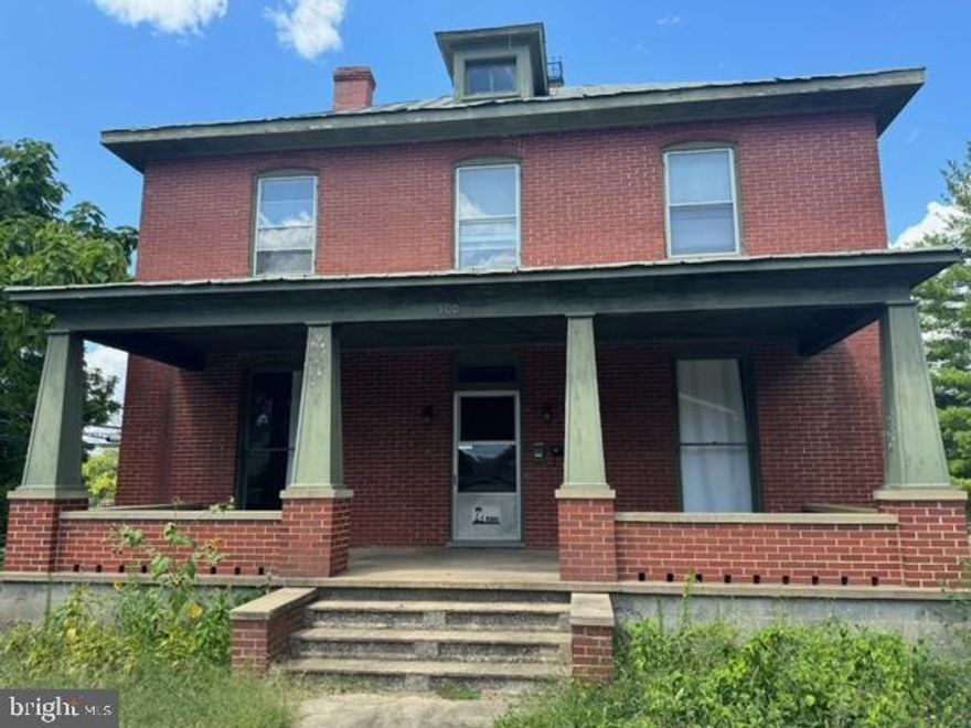 Welcome to your dream home! This four-bedroom, two-bathroom brick Colonial seamlessly blends timeless elegance with modern convenience. Currently a multi-family property but can be converted to a single family home. As you approach, you're greeted by a sprawling front porch—perfect for sipping morning coffee or enjoying evening sunsets. Step inside to discover a warm and inviting main floor, featuring a main floor bedroom with a fireplace and built in bookcases.  The first floor also has a full bath, living room/dining combo, & kitchen.  Ascend to the second floor where you'll find three additional bedrooms, a second kitchen and full bath provide added convenience and versatility. Imagine transforming the full walk-up attic into a luxurious master suite, an inspiring home office, or a playful children’s retreat. With a back porch off the upstairs kitchen, you can easily transition from indoor to outdoor living, perfect for weekend barbecues or serene moments in the sun. The home boasts an updated oil hot water furnace, comfort and efficiency in winter. Don't miss this opportunity to own a piece of classic elegance. This home is more than a place to live—it’s a lifestyle waiting for you to embrace. Schedule your private tour today and start the next chapter of your life in this captivating Colonial gem.