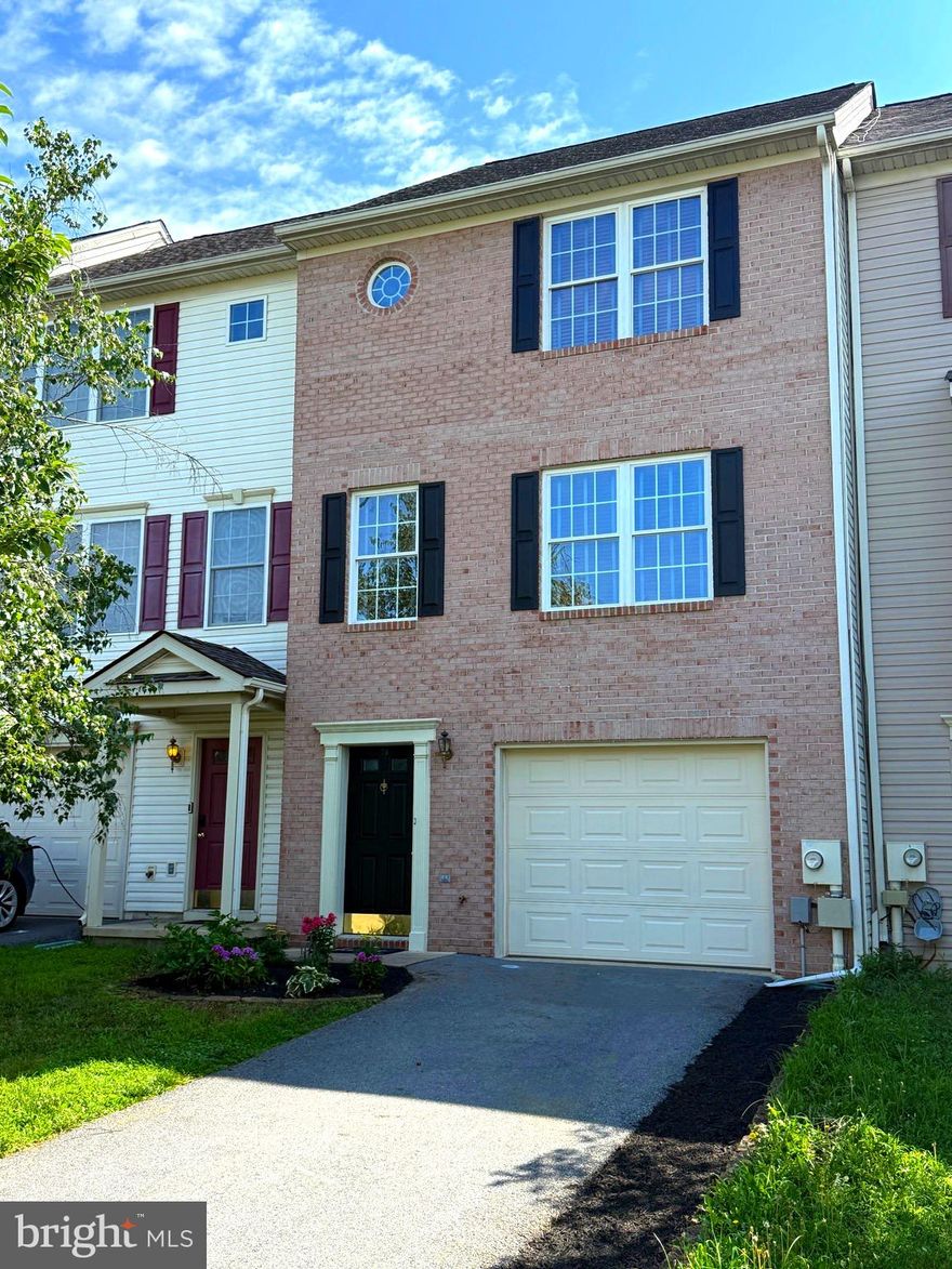 Beautifully Renovated 3-Level Townhouse in Sought-After Hammonds Mill! Welcome home to this brick-front townhouse located on a charming tree-lined street in the desirable community of Hammonds Mill. This spacious home spans three finished levels and offers modern upgrades throughout, making it truly move-in ready. Step inside to discover brand-new luxury vinyl plank flooring, fresh  paint, stylish new light fixtures, and an updated kitchen featuring brand new, gleaming GE stainless steel appliances,  granite counters, and pendant lighting. Your new oven even has an air-fryer mode! Pop out on your back deck to BBQ. The  new HVAC unit ensures year-round comfort and efficiency. Upstairs, the primary bedroom is complete with a tray ceiling, walk-in closet, and an updated en suite bathroom. Additional bedrooms have generously sized closets. The finished lower level has a bonus room perfect for your home office, hobby room, or gym. Enjoy the convenience of an attached garage and driveway for easy parking. The location is unbeatable—within only one square mile you'll find schools, medical facilities, shopping, and quick access to the interstate for an easy commute. Own a stylish, turn-key home in a thriving neighborhood—schedule your showing today!