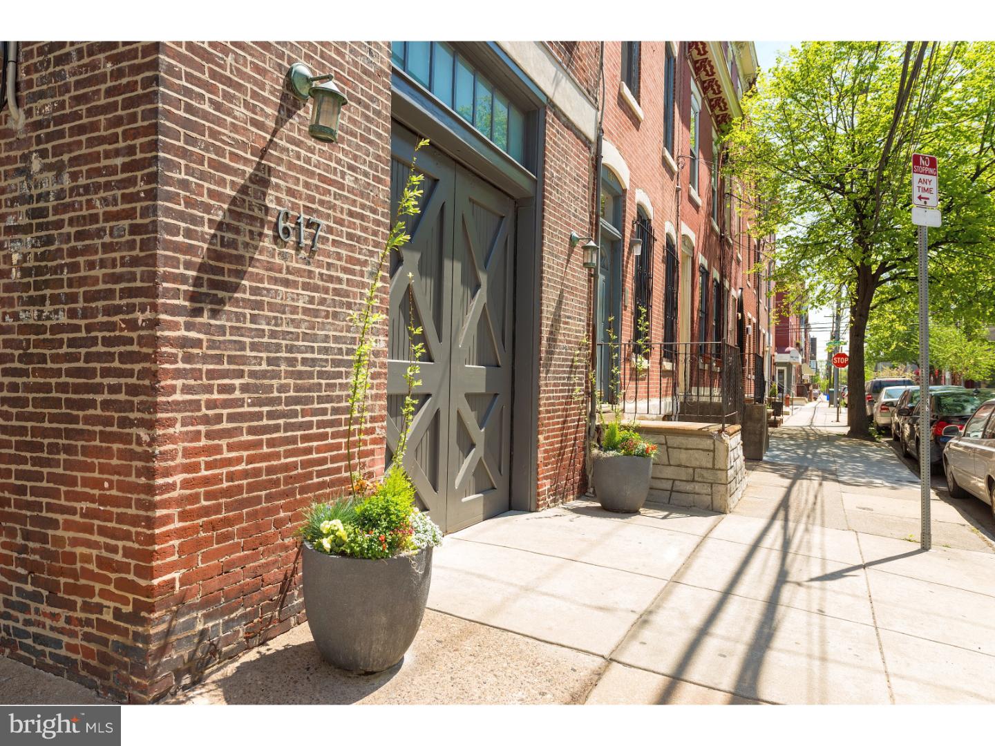 Completely renovated and rebuilt 19th century Carriage House. This Corner residence offers the finest taste and finishes. Exquisite quality. Large GARAGE. Lovely private patio. 11' ceilings on 1st floor; 9.5' ceilings on 2nd. Amazing light from 3 exposures throughout. 4 bedroom (or 3 bedroom + den), 2.5 bath. Hardwood floors and Lagos Azul stone tile. Custom Chef's eat-in kitchen with Sub Zero, Wolf, Asko appliances and custom cabinets. Open 1st floor plan, spacious living room with tasteful Pappajohn built-ins and radiant floors. 2nd floor master suite with sitting/dressing room, 2 huge custom walk-in closets, a Waterworks master bath, and a Juliet balcony overlooking the patio. The spacious garage features "carriage doors" (automatic), fits a full size SUV, and offers excellent storage. Totally rebuilt with a new 2-story addition, plus all new systems and replacement double-paned windows throughout the entire home. 3-zone hydroponic heat; 2 zone central air. Stellar location in the GREENFIELD catchment. 99 WalkScore--just one of the best locations in the City. 4 blocks to Rittenhouse Square, 1 block to South Street's restaurant row, easily walkable to markets, coffee shops, the city's best restaurants, and all that Center City has to offer.