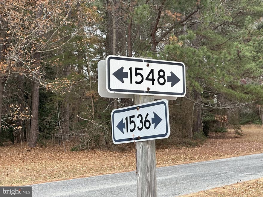 Level corner lot with trees, located in a waterfront community situated on Cabin Creek and the Potomac River. Features paved streets. Community amenities include sand beaches, pool, club house and pool.