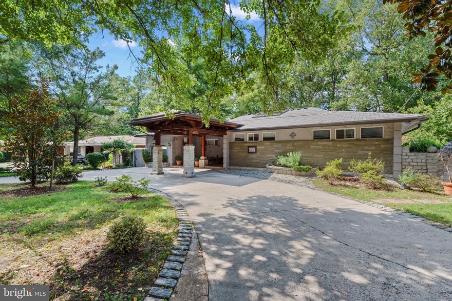 Welcome to this stunning single-family home that seamlessly blends Spanish charm with contemporary elegance. As you step into the grand entry foyer, you are greeted by soaring cathedral ceilings and high-end, hurricane-proof skylights that flood the space with natural light. The main level boasts exquisite Brazilian cherry wood floors, adding warmth and sophistication.

The state-of-the-art kitchen is a chef's dream, featuring top-of-the-line stainless steel appliances, Italian Varenna Poliform self-closing cabinets, quartz countertops, and sleek Porcelanosa backsplash. Sliding doors lead you to an adjacent deck, perfect for outdoor dining and entertaining. The deck is also equipped with a gas line for heaters and grills, as well as hardwired sound speakers for a seamless audio experience.
The living room opens to a charming balcony, while the separate formal dining room features a cozy wood-burning fireplace. And yes, there is a home office too!

The owner’s suite is a luxurious retreat with a stylish bathroom that includes a jacuzzi tub, Spanish tile, and a spacious walk-in closet. An adjacent nursery or home office provides versatility to suit your needs.

The lower level is a haven of additional living space, offering a bedroom with an ensuite bath, a library, and an exercise room complete with a whirlpool and sauna. Two storage rooms provide ample space for all your belongings. The family room, with its wood-burning fireplace, opens to a patio and barbecue area, perfect for gatherings. The partially covered flagstone patio includes a sitting and dining area, close to the barbecue grill, and the fully fenced backyard ensures privacy and security.

A circular driveway provides parking for 4+ cars, and the entire house has been reinforced to withstand hurricane winds. The slate-like composite tile roof comes with a 50+ year warranty, ensuring peace of mind for years to come.

Located in the coveted Whitman HS cluster, this home offers easy access to downtown Bethesda, Washington DC, and major highways. With its unbeatable location and top-of-the-line upgrades, this property truly has it all.