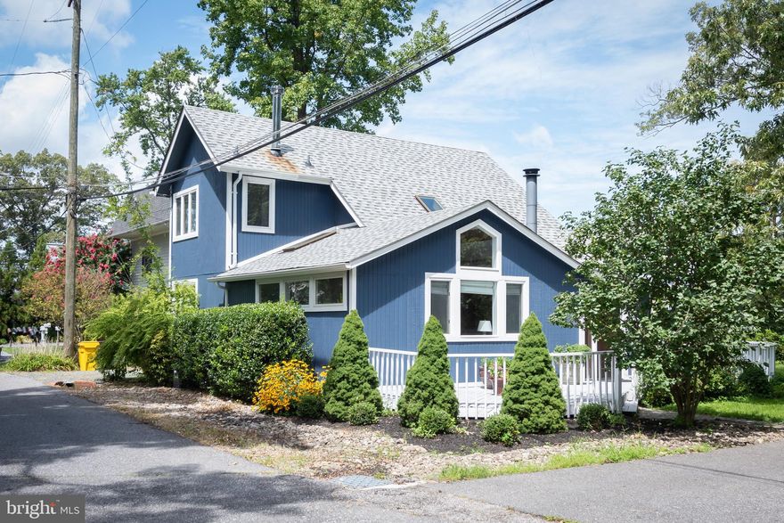 This whimsical staycation home is a perfect little gem providing delightful updates & the luxury of life on the Chesapeake Bay.  Located in the highly sought-after community of Idlewilde -- the tip of the Shady side peninsula -- and  just ONE home removed from BAYfront (Chesapeake Bay). Enjoy bay breezes and AMAZING WATER VIEWS! 

Features include a multitude of upgrades, including renovated baths, as well as open beamed ceilings, skylights, shiplap walls & ceilings, cathedral and vaulted ceilings, hardwood flooring,  plantation shutters, loads of natural light and a variety of lighting choices to suit your mood. 

The foyer with shiplap walls and ceramic tile flooring leads you to the  great room with exposed wood beams in cathedral ceiling, brick surround wood-burning fireplace,, a  brick accent wall flanking the staircase to the upper level with a large skylight.

Main level has open concept -- family room off sunny eat-in kitchen, with large windows, breakfast bar, stainless appliances and sliding glass doors to wrap-around deck.  French doors open to main floor bedroom, which could also serve as office, den or bonus room. Primary bedroom offers a gorgeous view of the Bay and passing sailboats from sliding glass doors leading to your private balcony, as well as a walk-in closet.

Two gorgeous FULLY renovated baths -- one with deep soaking/jetted tub, floor to ceiling tile, skylight, stone-topped vanity -- and the other with walk-in, jetted shower, skylight, linen closet & ceramic tile surround.

Impeccably maintained and well appointed home! Exterior and deck painted 2021, newer roof (2017), shed  (2015), stainless appliances (2017), sump pump (2017), professionally landscaped annually. Main level bath renovated 2016 ($30k) ; upper level bath renovated 2012 ($15k). Large shed in backyard, ideal for additional storage!

Avoid the time & expense of maintaining a dock & a sea wall, and just relax & enjoy this splendid cottage on the Bay with incredible views!!! Keep your boat at one of dozens of local marinas or the Chesapeake Yacht Club!   Enjoy relaxing in the community park, fish & crab from the community pier; as eagles, ospreys and cranes soar overhead. Hike in Jack Creek Park. Shady Side is only 45 minutes to DC & Alexandria, VA, 30 minutes from the Beltway, 25 minutes to Annapolis, and approx. 50 minutes to BWI.  Numerous seafood restaurants & tiki bars within  minutes from Shady Side; via boat or driving.   Deale offers several consignment shops, boutiques, cafes and marinas. Edgewater offers additional supermarkets and restaurants.  Won't last long!