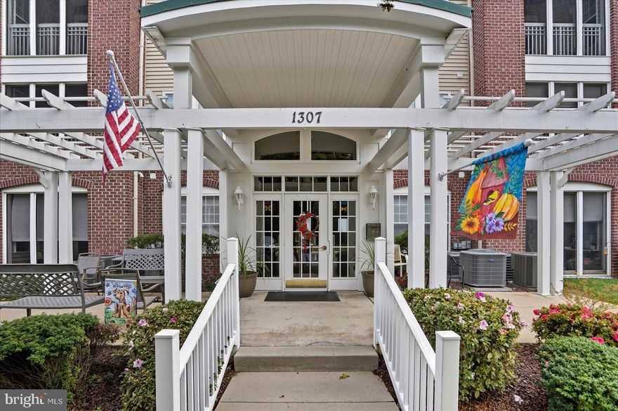 Remarkably Maintained makes this 2 Bed / 2 Full Bath 2nd Floor Condo Like New. The building provides no stair ramp access if needed with secure call in entry & elevator. The unit offers an open floor plan with 9 foot ceilings & LVP Flooring throughout. There is Plenty of Space with the family room, separate dining room and the large eat in kitchen that is open to the adjacent bonus room that has multiple large windows offering plenty of natural light. The kitchen offers granite counters, 42 inch solid wood front cabinets, island and double deep well sink. The condo offers a primary bed with walk in closet & step in closet along with the primary bath with walk in tiled shower and seat providing a primary suite. The 2nd bed is on the other side of the unit providing it's own space and privacy with the adjacent 2nd full bath. The unit offers a full laundry room with additional shelving for storage. The balcony is covered & screened in with privacy overlooking green space. This unit is turnkey and awaiting your arrival. Come and enjoy all this unit and community amenities have to offer!!
