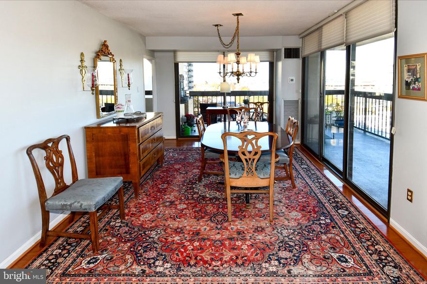 Seldom Available! Stunning 2 Bed + Den Condo with Spectacular Water Views!

Welcome to this rarely available 2-bedroom plus den condo at the highly sought-after Alexandria House condominium! Originally designed as a 3-bedroom unit, this flexible layout can easily be converted back to suit your needs. Enjoy breathtaking direct waterfront views of the Potomac River and iconic DC monuments from the comfort of your home.

Key Features:
- Expansive Living: Enjoy solid hardwood floors throughout the living, dining, kitchen, and den areas, creating a warm and inviting atmosphere filled with natural light and panoramic views.
  
- Gourmet Kitchen: 
  - Elegant granite countertops.
  - State-of-the-art Sub-Zero refrigerator.
  - Crisp white and glass-front kitchen cabinets for a clean, modern look.

- Ensuite Bedroom with floor to ceiling windows, 
 - Closet organization system
 - Luxurious marble bath with double vanities
 - Upgraded Carpet

- Bedroom 2
  - Floor to ceiling windows
  - Upgraded carpet
 
- Den
  - Built-in office desk, bookshelves, and drawers for efficient storage, making this space perfect for work or    relaxation.

 - Parking: Two oversized garage parking spaces provide convenient and secure access, along with an additional oversized storage space.


 - Outdoor Living: 
  - Rare 90-foot wrap-around balcony offering direct water views, perfect for entertaining or enjoying your    morning coffee.

- Bathroom 2
  - Shower and Bathtub
  - Updated Sink, Mirror, fixtures, and hardware.

 - Community Amenities:
 - 23rd Floor Rooftop Pool: Relax and enjoy incredible views, supervised by a lifeguard.
 - Community Room: Features a kitchen, balcony, panoramic views, and a cozy TV area, ideal for social gatherings.
 - Saunas and Roof Sundeck: An excellent place to unwind.

Lobby Level Amenities:
- 24/7 Concierge
- Convenient Facilities: Mail room, package room, Amazon hub, and Madison Room for gatherings.
- Fitness and Leisure: Fully equipped gym and lending library.

Garage Level Features:
- Secure Parking: Reserved underground parking with assigned storage units.
- Amenities: Oversized washer & dryer, bike room, electric car charging stations, and information display screens.

Vibrant Community Life: 

Engage with a well-run board and active committees, monthly newsletters, cocktail parties, new resident welcome events, and annual celebrations. Join one of the many clubs, including bridge, mindfulness, movie, writers, and collage groups!

Outdoor Enjoyment:
- Park: Alexandria House-owned park featuring serene gardens, benches, and lovely water fountains including one for your pet.

Don’t miss your chance to call this incredible property your home!