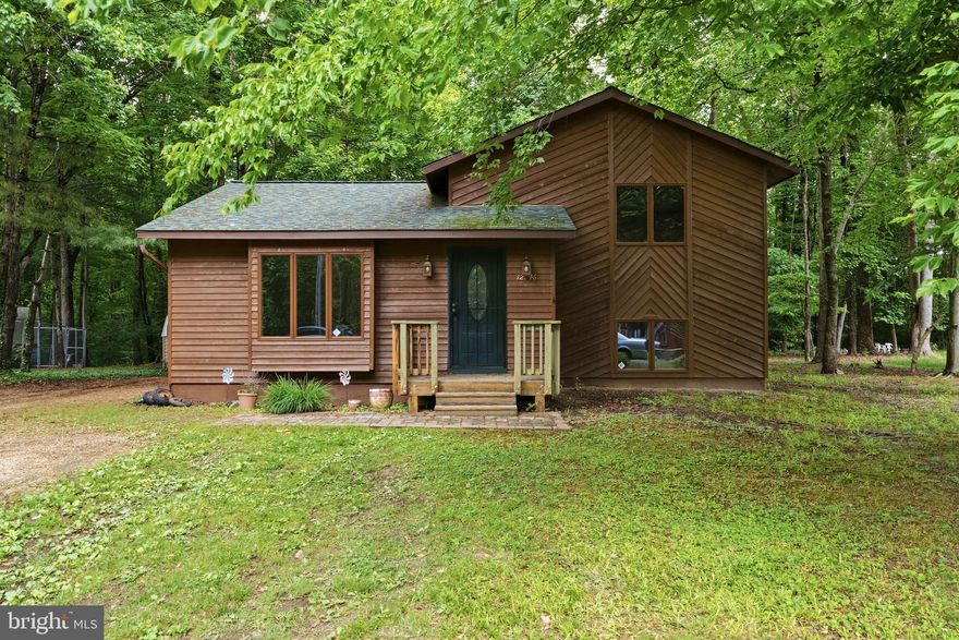 Fresh Paint & New Flooring! This 4 Bedroom 2 Bathroom Split Level is located on a perfectly flat lot with lots to offer!

Nestled among the trees in the desirable Chesapeake Ranch Estates community, this well-maintained 3-level split offers space, functionality, and access to some of Southern Maryland’s most loved waterfront amenities. Surrounded by mature trees and natural privacy, this home combines a peaceful setting with a flexible layout designed for everyday living.

The main level features a welcoming living room filled with natural light along with a spacious kitchen and dining area that offers plenty of room for gathering and entertaining. Sliding glass doors lead directly to the rear deck, creating an easy indoor-outdoor flow for relaxing, grilling, or enjoying the wooded backyard setting.

Upstairs, you’ll find three comfortable bedrooms and a full bath, while the lower level provides additional living flexibility with a fourth bedroom, full bath, and extra space ideal for guests, a home office, workout area, or recreation room.

Warm wood trim, large windows, neutral finishes, and multiple living areas give the home a comfortable and inviting feel throughout. Outside, the property offers deck space, a spacious yard, and a quiet setting surrounded by nature.

Located in Chesapeake Ranch Estates, residents enjoy access to incredible community amenities including private lake beaches, waterfront parks, playgrounds, hiking trails, and scenic Chesapeake Bay access areas that make it easy to enjoy the outdoors year-round.

Whether you're searching for a full-time residence or a peaceful retreat close to the water, this home offers a wonderful opportunity to enjoy the Chesapeake Ranch Estates lifestyle. Schedule your private tour today!