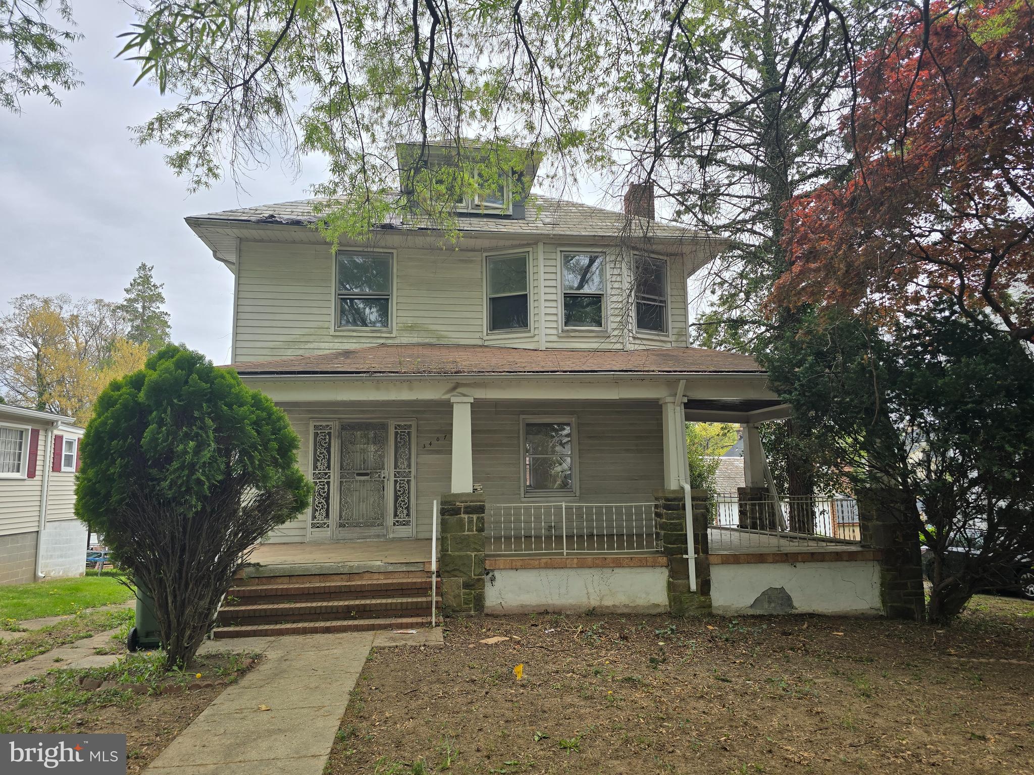 Buyers, Buyers, Buyers..........Today is your lucky day. I present to you 3407 Ellamont Rd in all of it's (soon to be) splendor. This stunning example of when homes were built to last is in need of someone to restore it back to it's former glory days or take it a step further. Absolutely great bones and 3 finished above ground levels. Walk around front porch, hardwood floors, finished attic and a full unfinished basement are just a few of the features. If you have been looking for the perfect rehab, this is it. Check out the neighborhood. These houses are in demand . Rough or Ready. They don't last long on the market. This is your chance ! Don't miss out on this opportunity . Hurry up and stop reading. Go now ! Oops. Forgot to mention the oversized garage in the rear. Now there is really no excuse for you not to go.