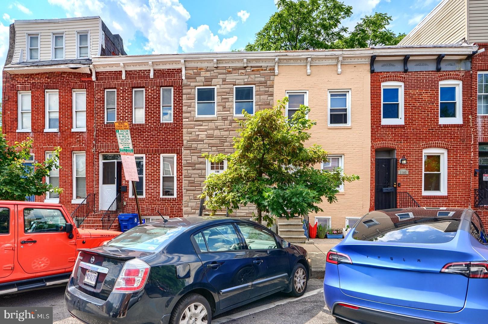 Don't miss this wonderful opportunity to rent this three-level solid brick townhome in the neighborhood of Washington Village! The main level features gleaming hardwood floors that flows from the spacious living to the dining area, and an updated kitchen with stainless steel appliances, granite countertops and white shaker cabinetry. The upper level showcases two well-appointed bedrooms with new carpet flooring, each with it own charm and, and two full bathrooms. The lower level is a surprise with is large recreation room with carpet flooring, half bath and another room that can be converted to a 3rd bedroom. Home is close to daily conveniences and has varied options of shopping, market, dining and entertainment.