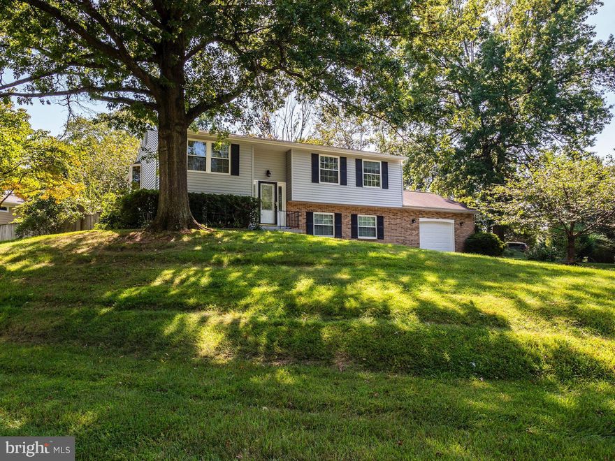 Picture perfect! You will fall in love with this beautiful 4 bedroom home.  It features a sun filled living room, an updated eat-in kitchen, 3 updated full baths, a screened-in porch, spacious lower level family room.  The home is sits on a large corner lot, has a fenced backyard and deck.   Plus there is an oversized one car garage.