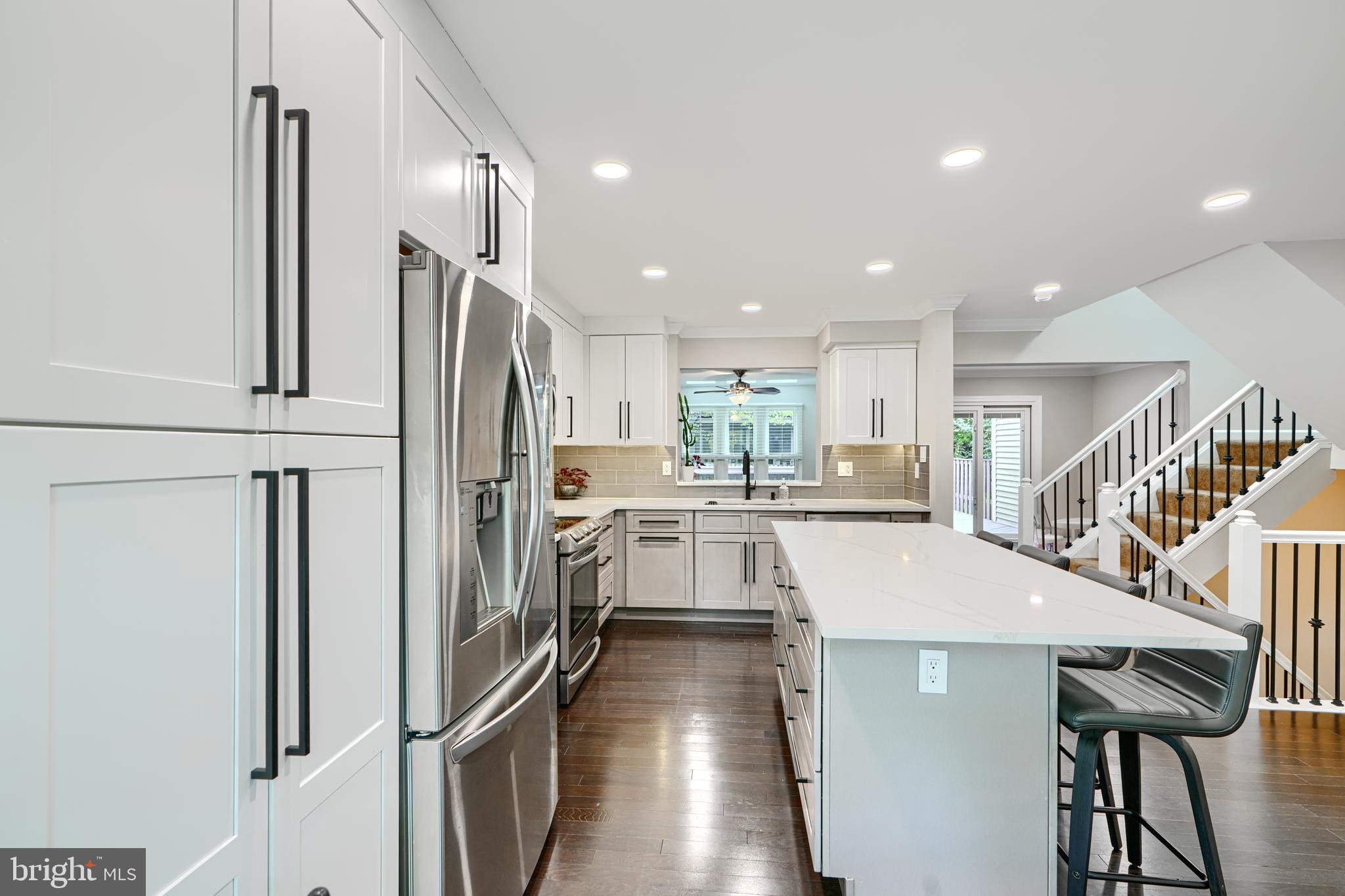 ***MULTIPLE OFFERS HIGHEST AND BEST DUE 8/5/2025 BY 7PM*** Welcome to 1 First Tee Court, the largest model in the highly sought-after Greens at Smith! This beautifully updated townhome features engineered hardwood floors and a fully renovated eat-in kitchen with a large island, abundant cabinetry, quartz countertops, stainless steel appliances, and a breakfast area. The open-concept dining and living spaces are filled with natural light from large windows and seamlessly flow to a spacious deck overlooking the fenced-in yard.
Upstairs, you'll find 3 bedrooms and 2 full bathrooms, including a renovated primary suite with a dual vanity, stand-up shower, and ample cabinetry for extra storage. The finished basement offers a versatile rec room/bedroom, a full bath, and plenty of storage space.
Recent upgrades include a new AC system, new windows and doors (featuring a premium sliding door with built-in blinds), renovated bathrooms and kitchen, new washer and dryer, gutters, downspouts, and custom landscaping with a beautiful walkway leading to the backyard.