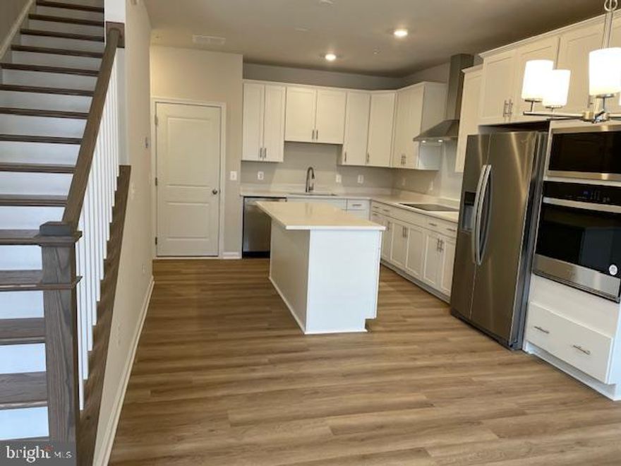IMMEDIATE DELIVERY! Brand New Dream Finders Condo Townhome in the Potomac Station Marketplace area in Leesburg, VA! Check out our beautiful Ballston condo floorplan, where comfort and convenience merge seamlessly. This beautiful 3-bed, 2.5-bath condo offers 1,547 square feet of living space, including main level living with a stunning kitchen, and a family room great for entertaining. Upstairs, you'll find your primary bedroom with an en-suite bathroom and a large walk-in closet - perfect for storing all your belongings! The two other bedrooms are just down the hall which share a full bathroom. The Ballston offers style and practicality for your everyday living needs. Come experience it today! Schedule an appointment or stop by and visit our model home today! Potomac Station Marketplace is within walking distance of retail as well as the W&OD biking trail. Meet with friends in downtown historic Leesburg or grab your weekly groceries at Wegmans right across the street. It's all right outside your doorstep. With convenient access to shopping, dining, and entertainment combined with proximity to several major commuting routes, Potomac Station Marketplace is an ideal choice for anyone who wants to work and play close to home. Visit us today! **MOST PHOTOS OF MODEL HOME**