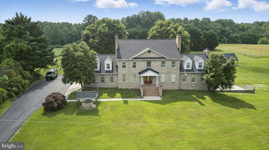 Grand Colonial Retreat on Over 2 Acres  -- A Rare Find!  Welcome to this stately 6 bedrooms,
 4 bathrooms Colonial nestled on 2+ acres of beautifully landscaped grounds in a peaceful, sought-after neighborhood.  With over 6,000 square feet of living space, this timeless residence offers a perfect blend of historic charm and modern comfort.  The five fireplaces create warm, inviting spaces throughout the home including the elegant living room, cozy family room and serene primary suite. .The  heart of the home is the kitchen --ideal for entertaining -- with formal dining and multiple gathering areas that flow seamlessly inside and out.  The private au pair/in law suite offers Its own entrance and full amenities, perfect for guests, extended family or household staff.  This is more than a home -- it's a lifestyle!   ***ASSUMABLE LOAN AT 4.25% ***