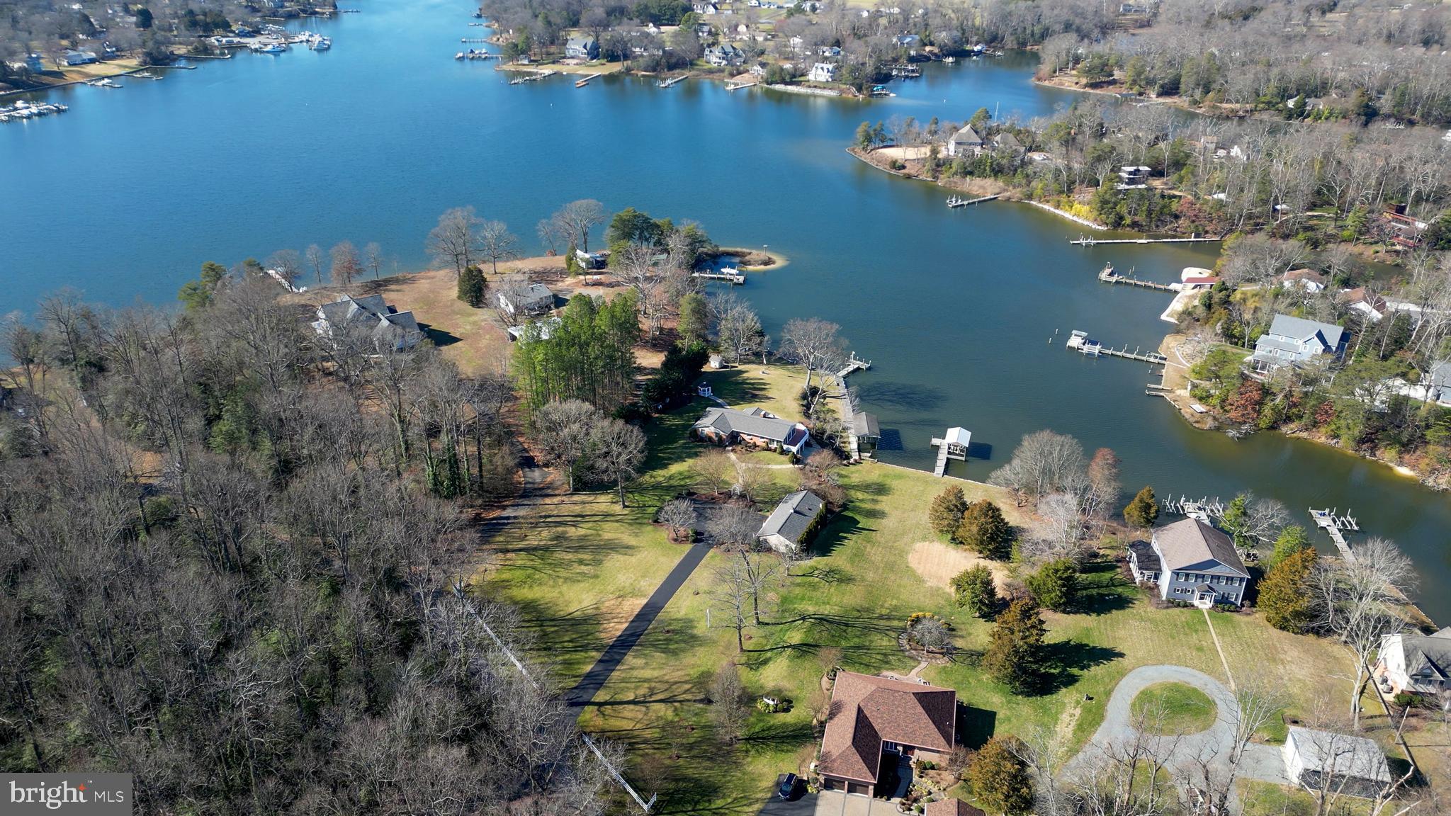 MAJOR PRICE IMPROVEMENT!
Experience the epitome of waterfront living at this exceptional property nestled along Spring Cove in the coveted Cuckold Creek of the Patuxent River. Meticulously maintained, this home boasts an extensive bulkhead that frames the shoreline, a wraparound pier, a private covered boat lift, and deep, protected waters, offering unrivaled access for aquatic adventures.
Entertain your friends and family on the expansive wraparound decking with an outdoor kitchen, fire pit, and screened patio, all set against breathtaking water views.
Inside the main home, discover a spacious open layout adorned with updated features, including a modern kitchen, three bedrooms, and three full bathrooms. The fully finished walkout basement provides additional living space and versatility.
Step outside to explore the mature, elegant landscaping surrounding the property, enhancing its natural beauty and tranquility.
The detached guest house offers privacy and comfort for guests or extended family, complete with a two-car garage for added convenience.
From sunrise to sunset, indulge in the luxury of waterfront living and create cherished memories in this idyllic retreat.
Schedule your private tour today and discover the allure of this waterfront gem!