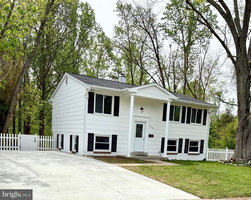 Welcome to 15129 Concord Drive, where thoughtful renovations meet timeless design in this move-in ready, 3-bedroom, 2-bath split-level home in Woodbridge, VA. From the moment you arrive, you'll notice the freshly poured concrete driveway that accommodates up to five vehicles, brand new roof and gutters, and freshly painted exterior offering instant curb appeal. 
Inside, the home opens to a beautifully redesigned kitchen featuring brand new white cabinetry, quartz countertops, a stylish island bar perfect for entertaining, and a full suite of new stainless-steel appliances. The light-filled living spaces are enhanced with new windows and a sliding door that brings in natural light and frames serene backyard views. Both bathrooms have been meticulously updated with new tile work, vanities, bathtubs, and lighting for a clean, modern finish. 
Relax or entertain in your expansive backyard — a private retreat backed by trees and complete with a charming shed for extra storage or a workshop. With a brand-new HVAC system, fresh interior paint, and new washer and dryer, this home is as turnkey as it gets. 
Situated just minutes from I-95, Potomac Mills, and a variety of shopping and dining options, this home blends convenience, comfort, and charm into one stunning package. 

Don’t miss your chance to own this beautifully updated Woodbridge home! 

ALERT! Long & Foster Real Estate will never send you wiring information via email or request that you se