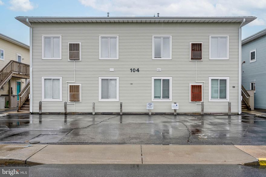 INVESTOR'S DREAM! Bring your tape measure and paint brush to this  3 bedrooms, 2 full baths condo with your own deeded boat slip.  It won't take much to bring this Beach Home up to your standards.   This home is located 1 block to the beach, walking distance to the Food Lion and very convenient for walking to The Original Green Turtle, Dunkin Donuts, The Crabcake Factory and so many other great places.  The association replaced the siding, stairs and roof in 2017.    Main bedroom overlooks the canal and  boat slip with sliders to the deck.  Main bedroom also has full bath.  The 2nd and 3rd bedrooms are decent sized and ready for your family and friends to come and visit.  This is a Diamond in the Rough and Priced to Sell.