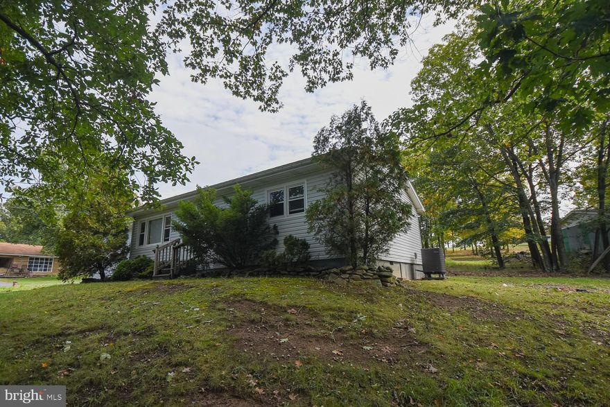 Welcome to 194 Windy Hill Dr. Situated on just over half an acre on the outskirts of Keyser, WV . The original build of the house includes 2 bedroom and a full bath. Nice hardwood flooring. The garage was transformed into another bedroom/living space with an attached full bath. The closed in breezeway gives easy access from the main area of the house to the additional bedroom/living area. Eat-in kitchen with plenty of storage shelves in the connecting laundry room. Come check it out!