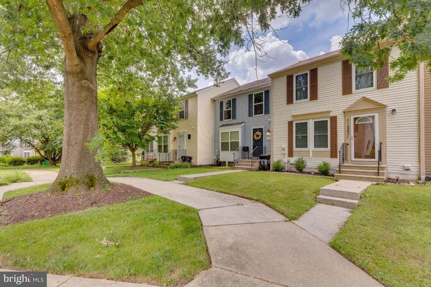 A beautifully updated three-level townhome in the heart of Bowie! 11260 Westport Drive is a spacious 4 -bedroom, 2.5 bath home featuring a thoughtfully designed layout with fresh, neutral finishes throughout. The main level boasts a sun-filled living room, a modern kitchen with granite countertops, stainless steel appliances, and a large island with seating, flowing seamlessly into the dining area with sliding glass doors that lead to an oversized deck, perfect for entertaining. Upstairs, the primary bedroom offers ample space, dual closets, and plenty of natural light. Two additional bedrooms share a full hall bath with updated finishes. The fully finished walk-out lower level includes a large rec room, a full bathroom, and a separate utility/laundry area, offering flexible space for a guest suite, home office, or gym. Enjoy outdoor living with a fenced backyard, upper deck, and covered patio. Located just minutes from Bowie Town Center, Allen Pond Park, and multiple grocery options, including Harris Teeter and Giant. Easy access to Route 50, MD-197, and the MARC train makes commuting to DC, Annapolis, or Baltimore a breeze. Close to schools, trails, and playgrounds, this home checks all the boxes!
