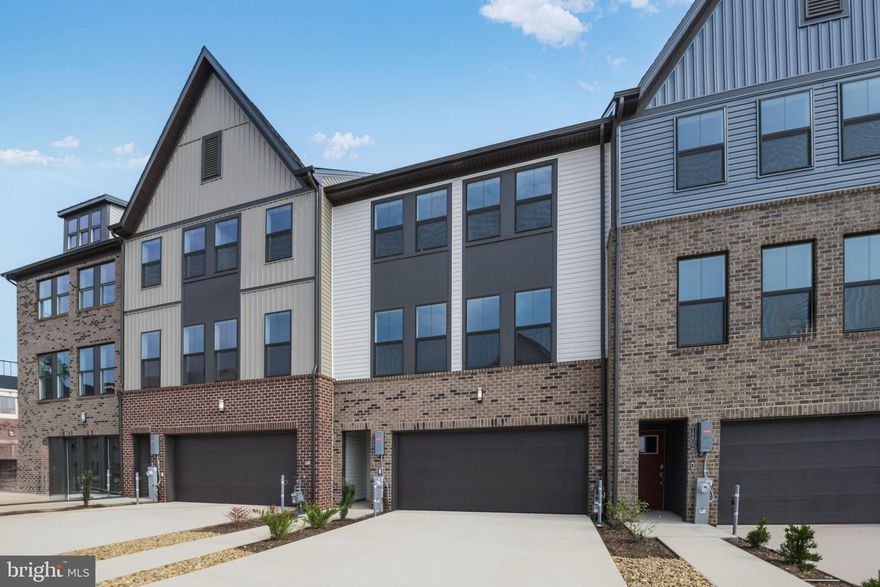 Summer Move-In, Pre-Construction Pricing . New floorplan, 4 level elevator 3 bedroom townhome located in Watershed, Lennar Homes newest community in Anne Arundel County offers the promise of convenience comfort and style.  Amenity-rich living with two pools, clubhouse, fitness center, yoga, amphitheater and pavilion, walking and biking trails, dog park, fire pits and more.  The first floor with a half bath leads to your back yard makes it perfect for family and guests.  Carry your groceries with ease in the elevator to the main living level with powder room, kitchen, dining and great room.  Designed with style are staggered height 36 and 42 inch kitchen cabinets with soft close doors and drawers.  Frigidaire Gallery stainless appliances include, 5 burner gas cooktop with a direct vent range hood, a hidden controls dishwasher, built-in microwave oven and to complete the package a counter-depth French Door refrigerator with built in water and ice.  Granite countertops in the kitchen and all full baths will provide durability and lasting beauty.  Enjoy the large center island with seating space for 4 or more and overlooks the dining area and great room.  Off the great room is your deck with space for grilling, relaxing with family and friends or a good book, providing an ideal set-up for modern living.  Your elevator or stairs will take you to the bedroom level catering to intimate spaces with a laundry room and a separate walk-in-linen closet.  The private owner’s suite is complemented by a spacious walk-in-closet and a full-sized bathroom with a granite or quartz topped double vanity and a spacious shower with frameless door and seat. Two secondary bedrooms and a full tiled bath with double granite topped vanity complete this level.  Going Up…last stop on the elevator is the 4th level loft with a powder room and a beautiful outdoor deck that offers you the ability to unwind, entertain, grill, listen to nature the options are endless. A driveway and two car garage provide parking and storage. Prices and features may vary and are subject to change without notice.  Conveniently located to grocery shopping, entertainment, Arundel Mills Mall, Waugh Chapel Town Centre and an effortless commute to BWI Airport, Washington DC, Annapolis, Fort Meade and Columbia. Photos are for illustrative purposes only.