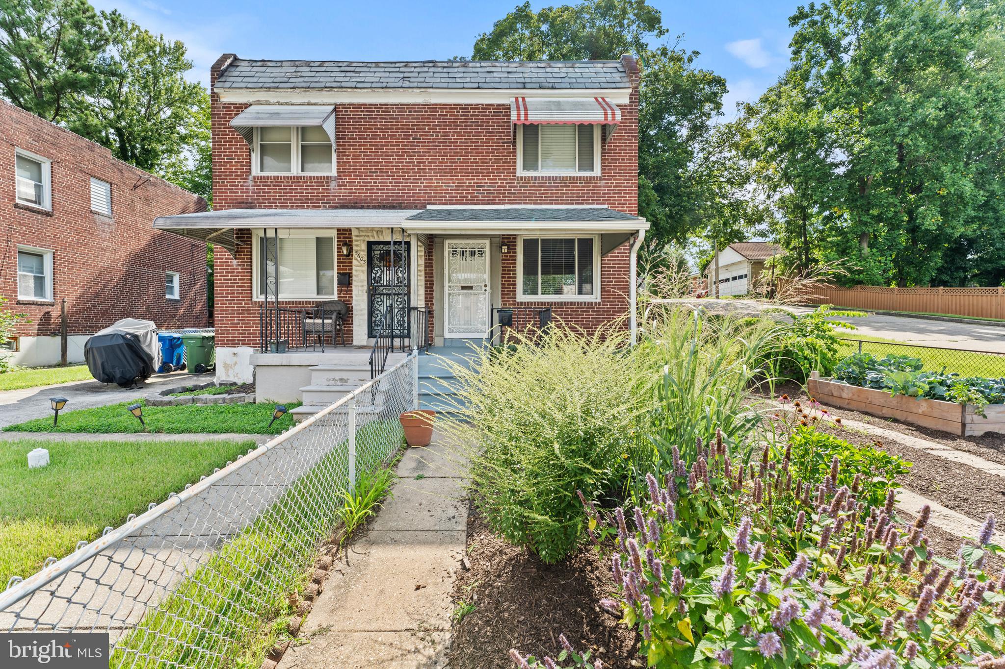 Cute Hamilton home on a corner lot, with tons of potential and in a quiet, convenient location! Six-year-old roof, modern bathroom including heated floor, freshly painted interior, and hardwood floors throughout. Separate dining room w/ corner built-in cabinet. Native flower & vegetable gardens in front yard including young Eastern Redbud tree. Fenced rear yard with walkout basement. Kenmore washer and Whirlpool dryer included. This home is in walking distance to many hot spots including Koco's Pub, Silver Queen Cafe and Zeke's Coffee; also multiple grocery stores and Home Depot are nearby. Quick access to I-695, Towson, Loch Raven Reservoir and close to Morgan St University. Herring Run Park & Lake Montebello are minutes away.