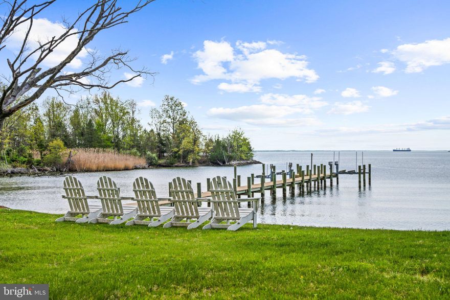 A Rare Waterfront Legacy Property on the Chesapeake Bay:
Along a quiet stretch of Annapolis shore, where the Chesapeake meets 232 acres of protected parkland, a singular offering emerges. Few properties in the region can claim its provenance, privacy, and position on the water.
Set upon 3.5 acres overlooking Moss Pond, the farm commands 287 feet of private shoreline with sweeping, unobstructed vistas of the Bay beyond. Once part of a celebrated working thoroughbred operation, it carries forward a legacy deeply woven into Maryland's agricultural and maritime heritage.
At the heart of the property stands a historic farmhouse of quiet distinction. Five well-appointed bedrooms each capture views of the water, and a series of gracious sitting rooms preserve the residence's original character. Heart pine floors, bespoke built-ins, and twin staircases speak to an era of craftsmanship rarely preserved so thoughtfully. A screened-and-glassed porch extends the season year-round, while a waterside patio invites summer dinners and sunset gatherings with the Bay as backdrop.
Beyond the main house, a four-car carriage barn, a second barn with equestrian stalls, and a detached retreat suited to a study, studio, or guest quarters lend the property remarkable versatility. At the water's edge, a private pier offers immediate access to the boating and fishing traditions for which the Chesapeake is justly renowned.
Bordered by parkland yet a short drive from Annapolis, the farm offers the increasingly uncommon pleasure of true seclusion without sacrifice, moments from the cultural and culinary life of Maryland's historic capital.