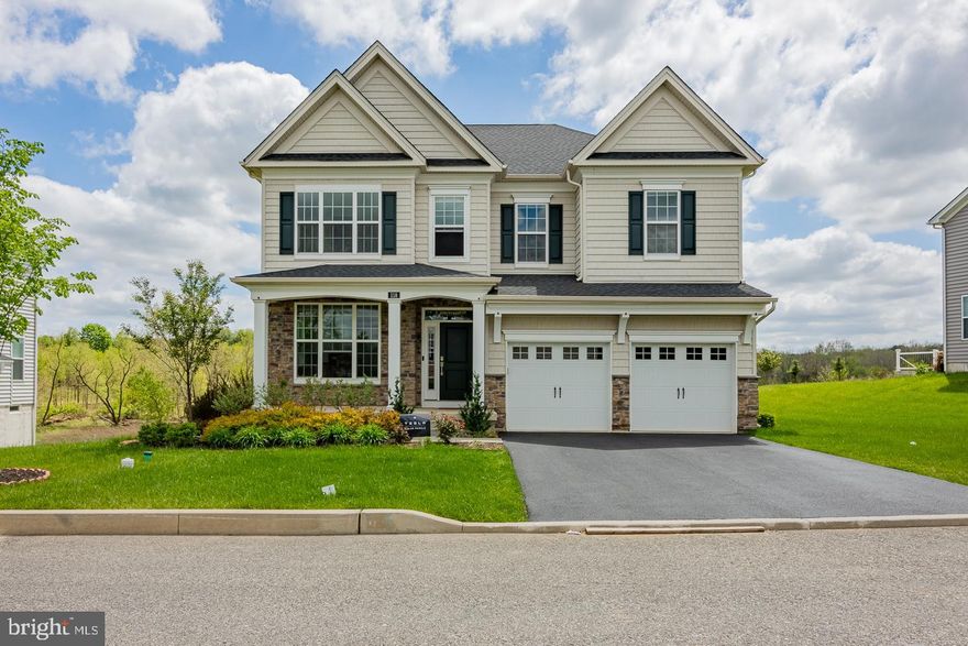 Don't miss out on this rare find! This 3-year-old single family home is located in the Great Valley Crossing community, built by Toll Brothers. This house faces North, and is situated on a premium lot that offers a spacious backyard fringed by protected wooded land and  breathtaking  views. This 5 bed, 4 bath house welcomes visitors with an open floor plan that leads into a bright and sunny upgraded kitchen complete with quartz countertops, a custom designed pantry, and upgraded appliances. The sliding doors in the family room lead out to a large, inviting deck. First floor also has guest bedroom and full bathroom This home is also equipped with Tesla solar panels that are fully paid by the seller, and save a lot on utility bills. In addition, the entire first floor is hardwood, as well as the oak stairs and common areas on the second floor. The 4 bedrooms on the second floor are all spacious and well-ventilated, allowing for convenient access to the laundry room as well.  The large, ready-to-be finished basement also has a walk-up entrance leading to the backyard. Located in the award-winning Great Valley School District and nearby to major highways and corporate offices, this house is sure to be a fantastic new home. Schedule your visit today!