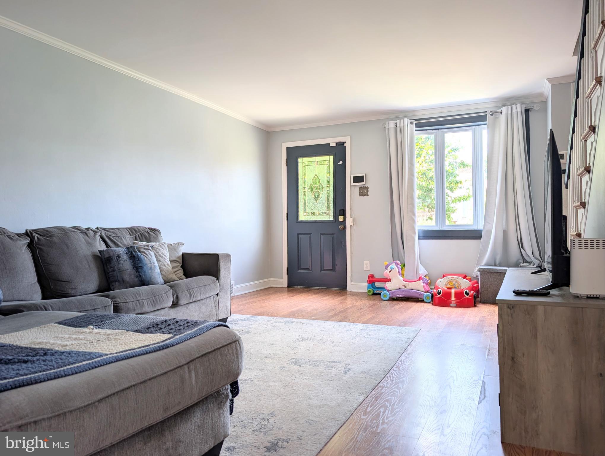 Tucked away on a quiet block in Glenolden, you'll find 320 Spruce St. This updated 2-story home has 3 beds, 1 bath, a finished basement, central a/c, a deck, and a garage. Out front, you're welcomed by a lush lawn and a charming patio that's the perfect spot to relax on warm summer evenings. Inside, modern floors stretch across the large, airy living room, brightened by a bay window. At the rear, the open dining area and kitchen have lots of counter and cabinet space, and a full suite of appliances, including a dishwasher, a ceiling fan, and a chair rail. A pair of sliding doors lead to the expansive rear deck, ideal for family barbecues and al-fresco dining. The second level has a large, bright bedroom at the front, a full bathroom at the center, and two more bedrooms at the rear. Completing the home is a finished basement that could act as a den, gym, or playroom. It also has the laundry and access to the garage and driveway. 320 Spruce St's fantastic location is just off W Oak Lane, allowing easy access to shopping centers on MacDade Blvd, Providence Rd, and Baltimore Pike. Schedule your showing today!