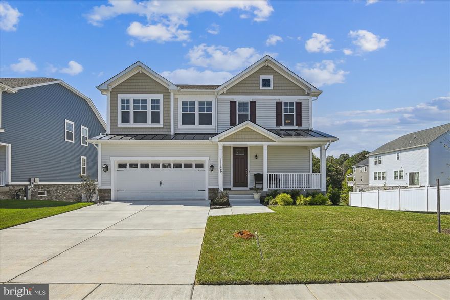 3% Interest Rate!!   This home has an FHA assumable mortgage !!  Save thousands and thousands of dollars!!  Stunning Craftsman/Colonial in Red Run Reserve - 4 BR, 2.5 Baths with over 3000 immaculate square feet of  Builder Upgrades Galore!  Bright and airy with lots of natural light and scenic nature views. Built in 2021, this home is crisp, fresh and move in ready with a plethora of convenient special touches to add to your quality of life!  Quality and value are apparent throughout with 8' doors and 9' ceilings, gleaming hardwoods, executive level vanities, internet hardwiring and more! Feast your eyes on the  spectacular  gourmet kitchen featuring GE Profile appliances, soft close doors and drawers, cabinet crown moldings,  ginormous island with double sink and 6 person seating, and 5 burner gas cooktop with contemporary  hanging stove exhaust.  Spacious sunroom or formal dining room and  open family room  complement the visuals of the open floor plan.  The roomy Primary bedroom with en suite full bath features a jetted tub, full shower and sizable walk-in closet. This Bedford model has been lightly lived in and is situated on a premium lot with generous oversized garage, large rear no maintenance deck and cement patio all with wonderful wooded views of evening sunsets and star gazing will unwinding from the days labors.  You just need to see this home!   So much to love! No need to build or wait for your forever home!